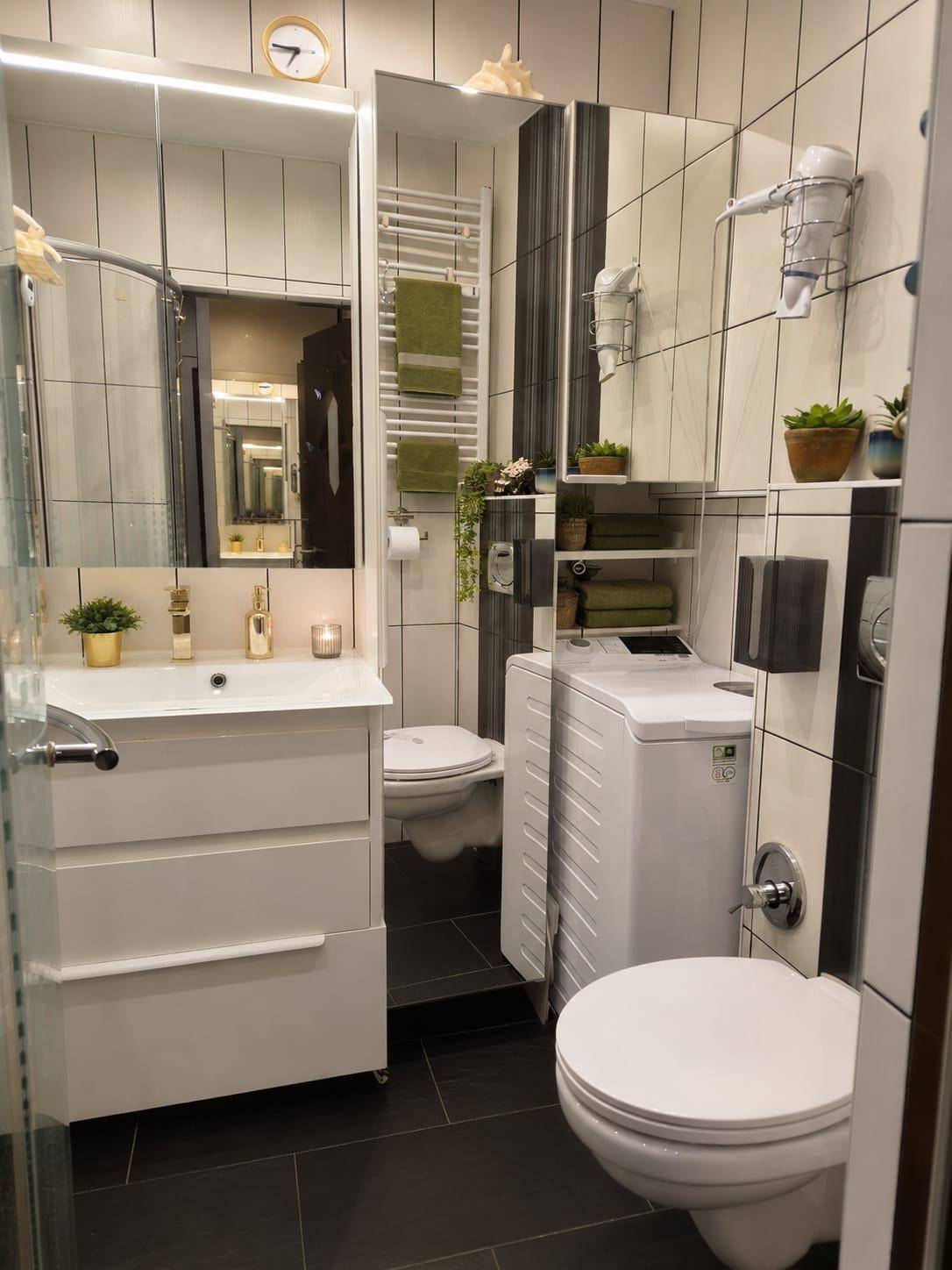 Modernes Badezimmer mit Dusche, Waschmaschine, WC und beheiztem Handtuchhalter.