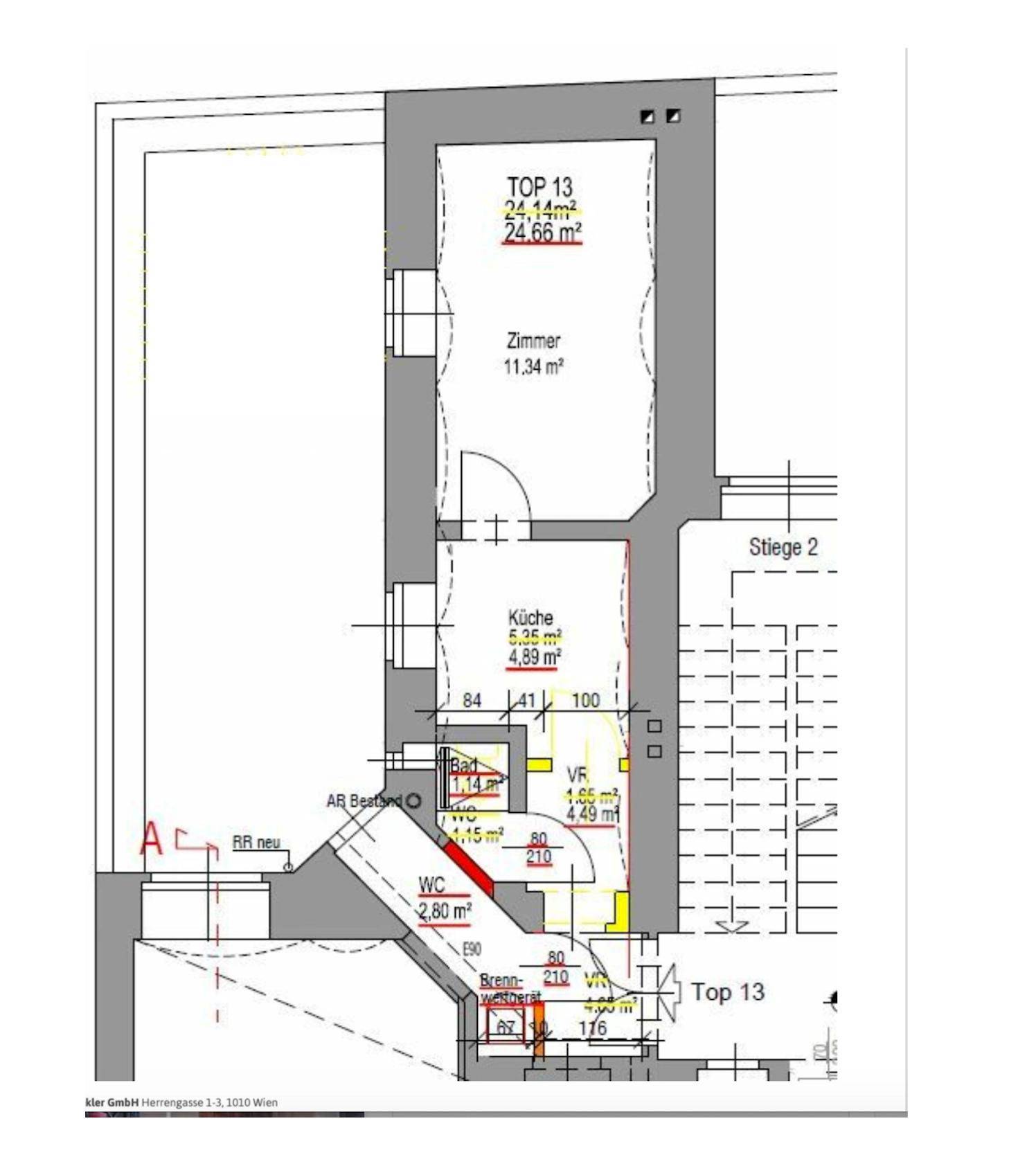 Ansicht der modernen Fassade eines Mehrfamilienhauses mit Dachausbau und geparkten Autos davor.