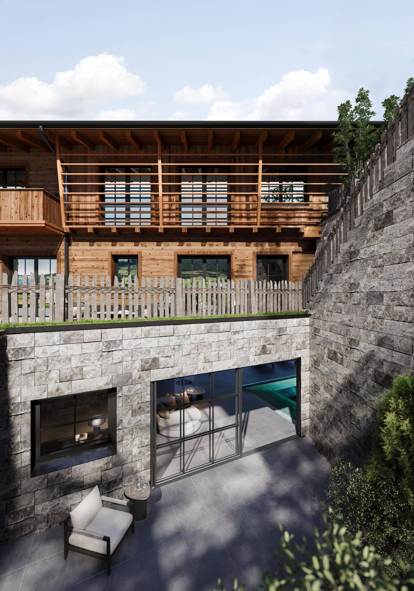 Moderne Fassade eines Holzchalets mit Steinmauer und Zugang zum Untergeschoss mit Pool.