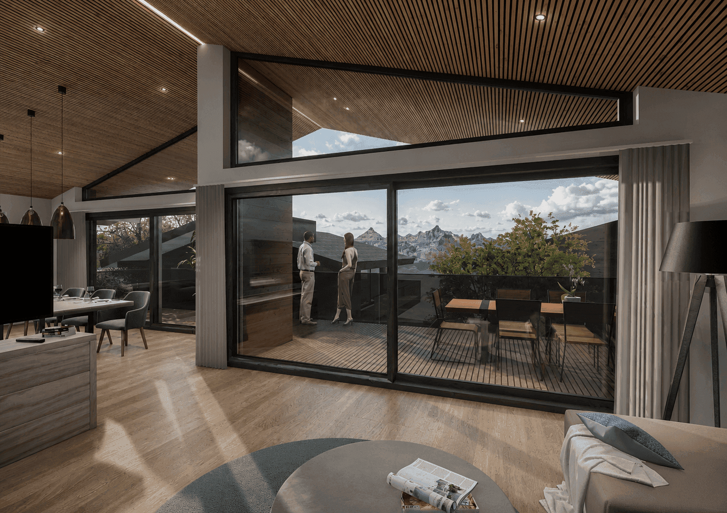 Heller Wohn- und Essbereich mit Holzboden, hohen Decken und Zugang zu einer Terrasse mit Bergblick.