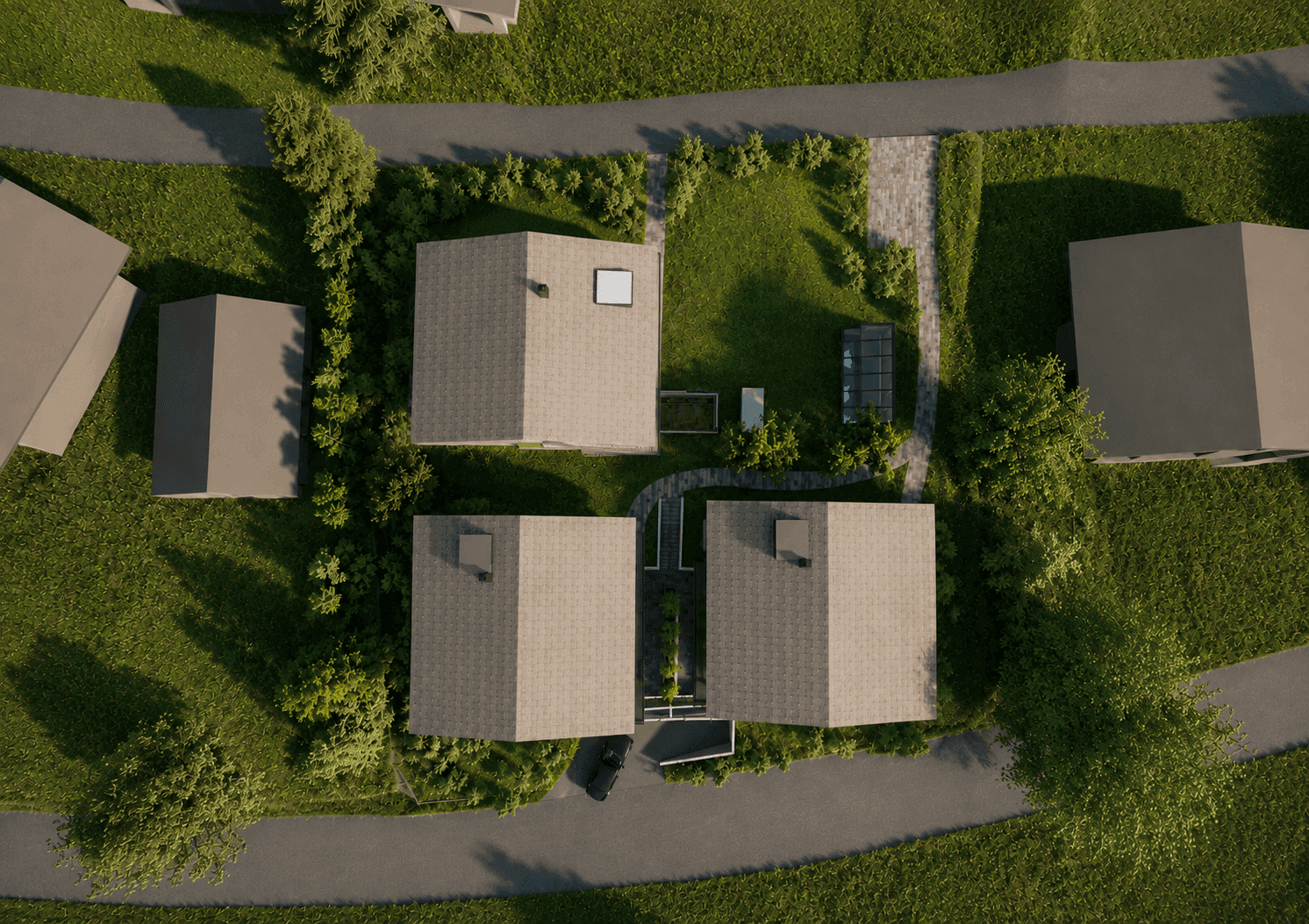 Luftaufnahme eines Wohnkomplexes mit mehreren Gebäuden und grünen Außenbereichen.