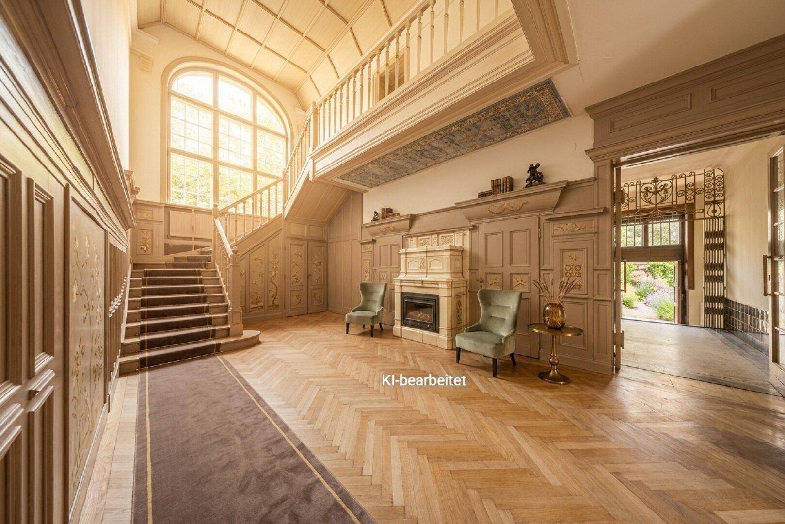 Die helle Eingangshalle mit Fischgrätparkett, einem Kachelofen und eleganten Sitzgelegenheiten.
