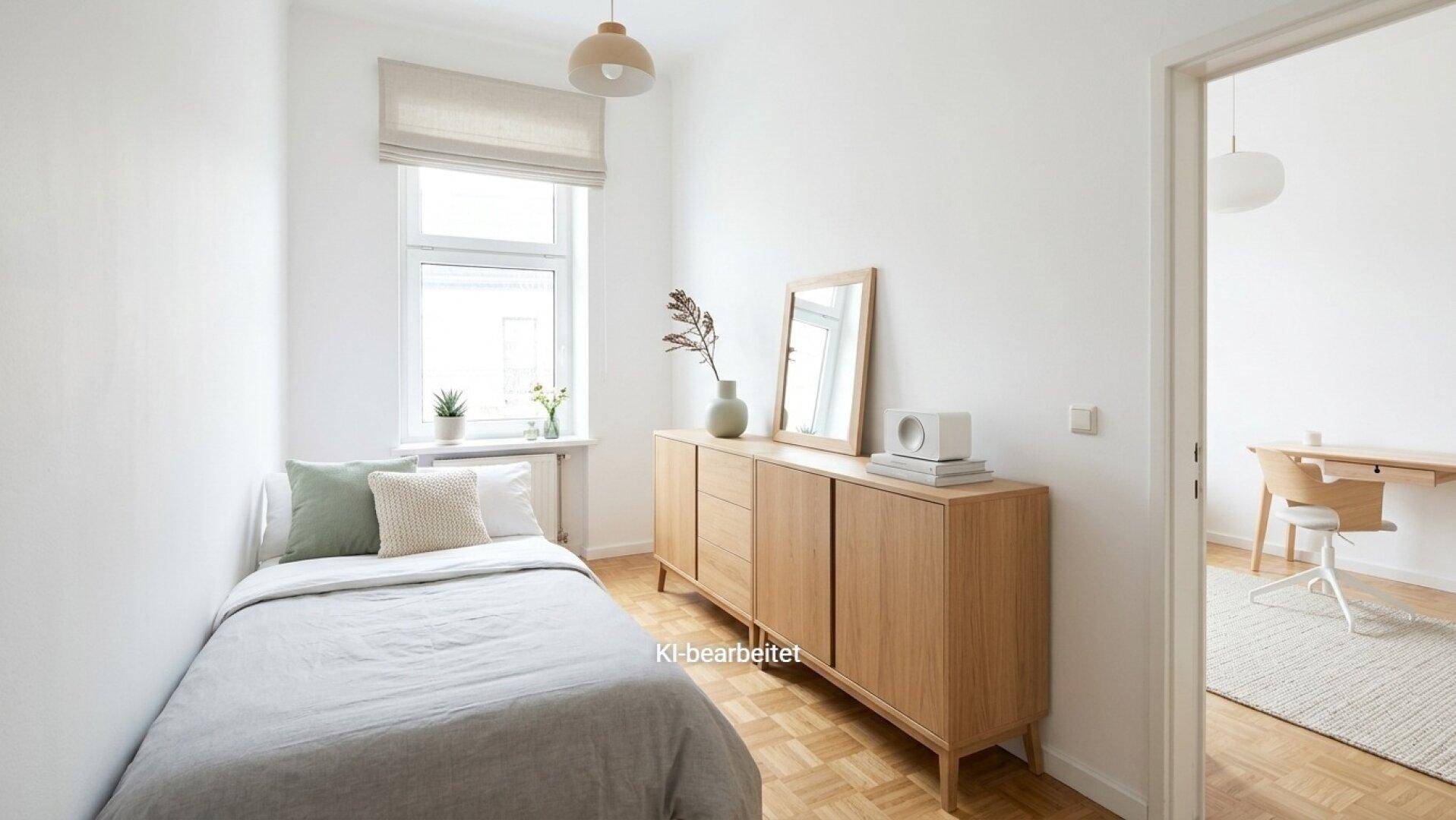 Helles, modern eingerichtetes Schlafzimmer mit Einzelbett und Holzkommode.