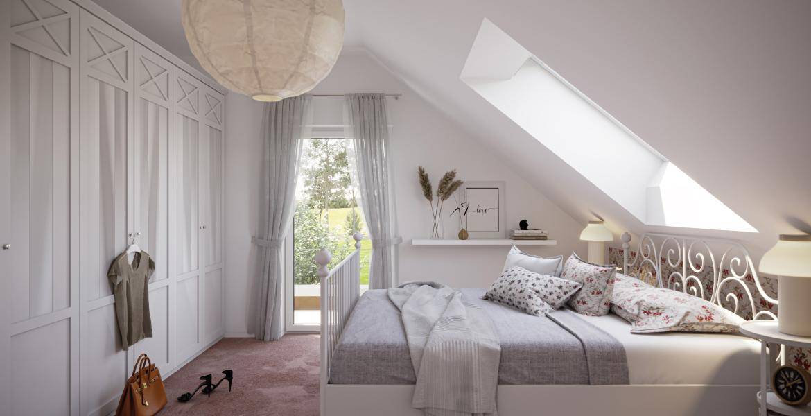 Gemütliches Schlafzimmer im Dachgeschoss mit Dachfenster, Einbauschränken und Blick ins Grüne.