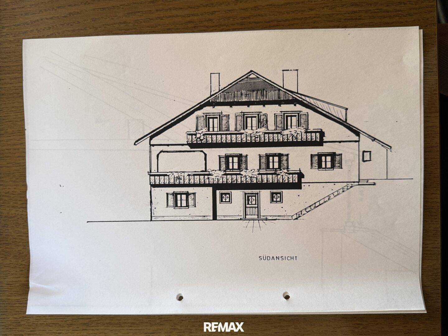Architektonische Zeichnung der Südansicht des Gebäudes mit Balkonen.