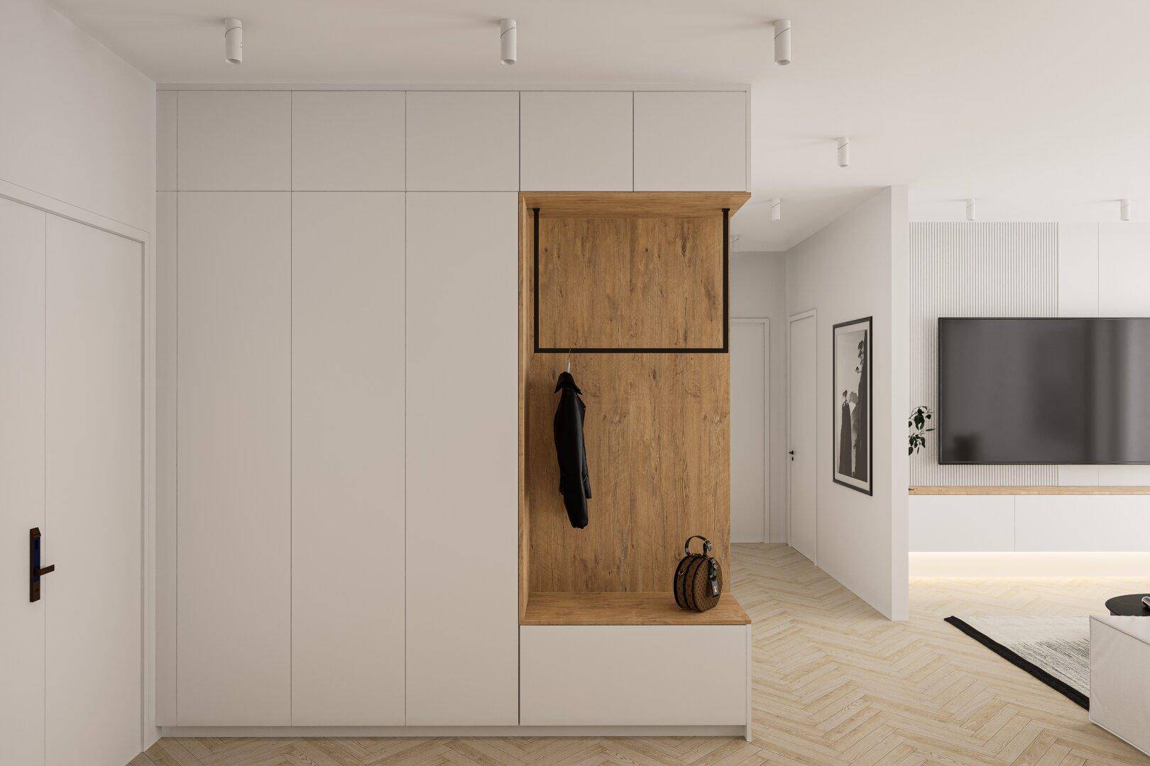 Modernes Entree mit integriertem Garderobenschrank und Holzdetails, hell und einladend gestaltet.