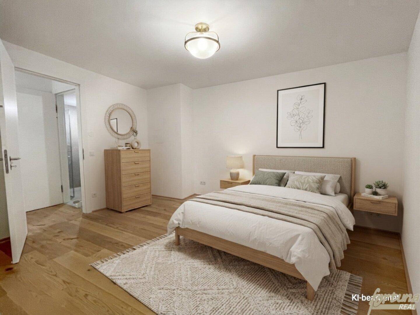 Modern eingerichtetes Schlafzimmer mit Holzboden und Zugang zu einem angrenzenden Badezimmer.