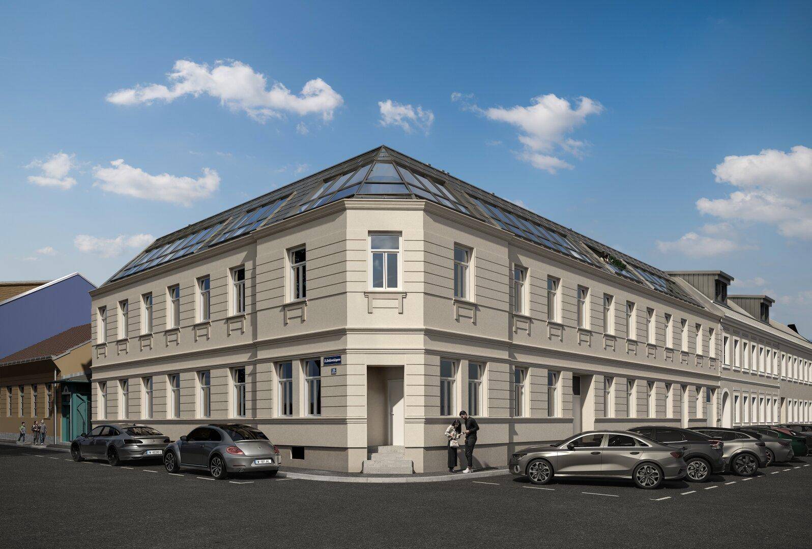 Eckgebäude mit moderner Architektur, großen Fenstern und Parkmöglichkeiten am Straßenrand.