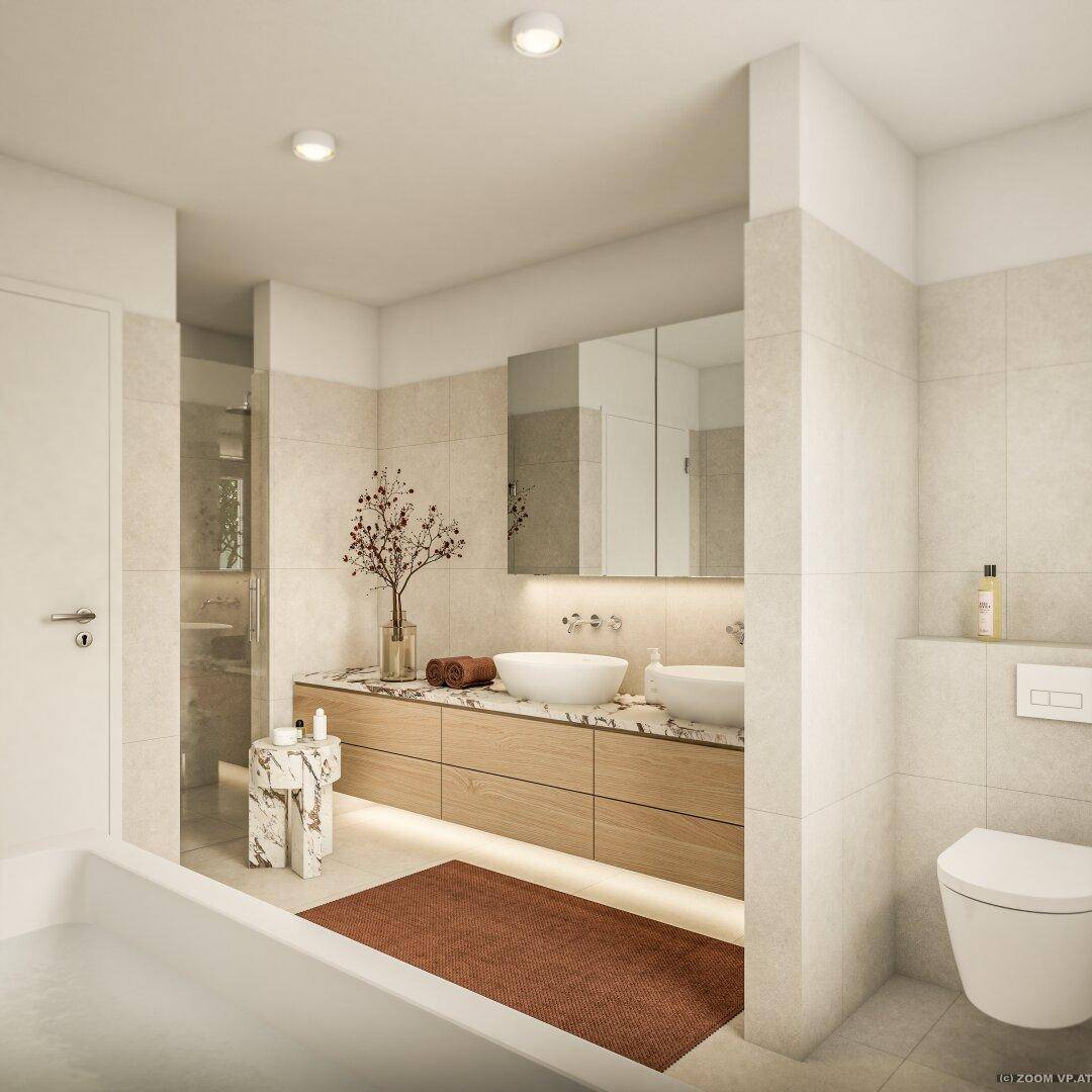 Helles Badezimmer mit Badewanne, Doppelwaschbecken und begehbarer Dusche.