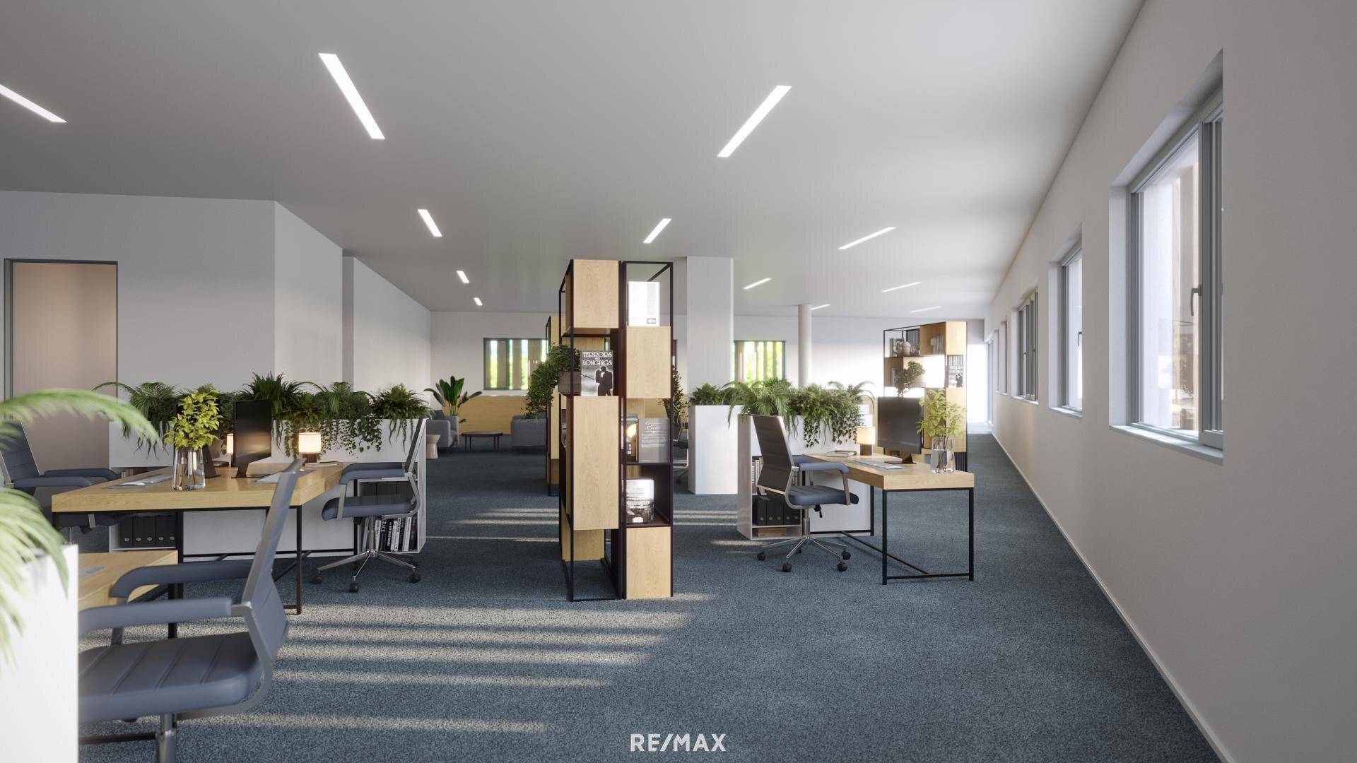 Helles Großraumbüro mit modernen Arbeitsplätzen, Teppichboden und vielen Grünpflanzen für angenehme Atmosphäre.