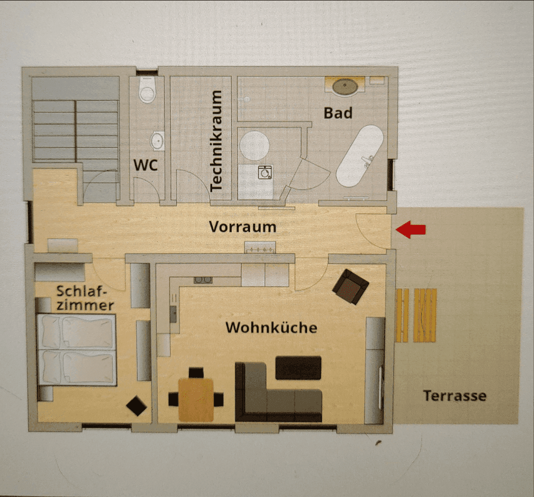 Grundriss einer Wohnung mit Wohnküche, Schlafzimmer, Bad, WC und Terrasse.