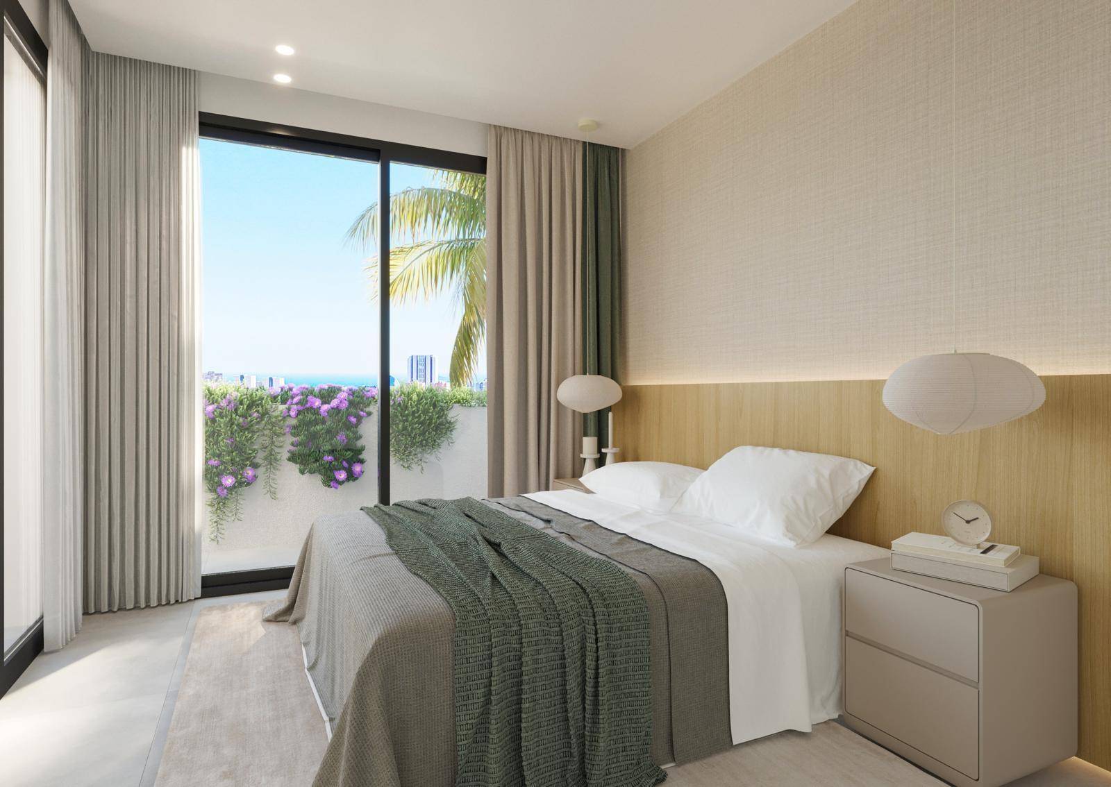 Helles Schlafzimmer mit Balkonzugang, Meerblick und moderner Einrichtung.