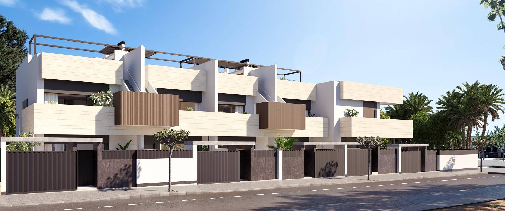 Moderne Reihenhäuser mit Balkonen und zeitgenössischem Design in sonniger Umgebung.