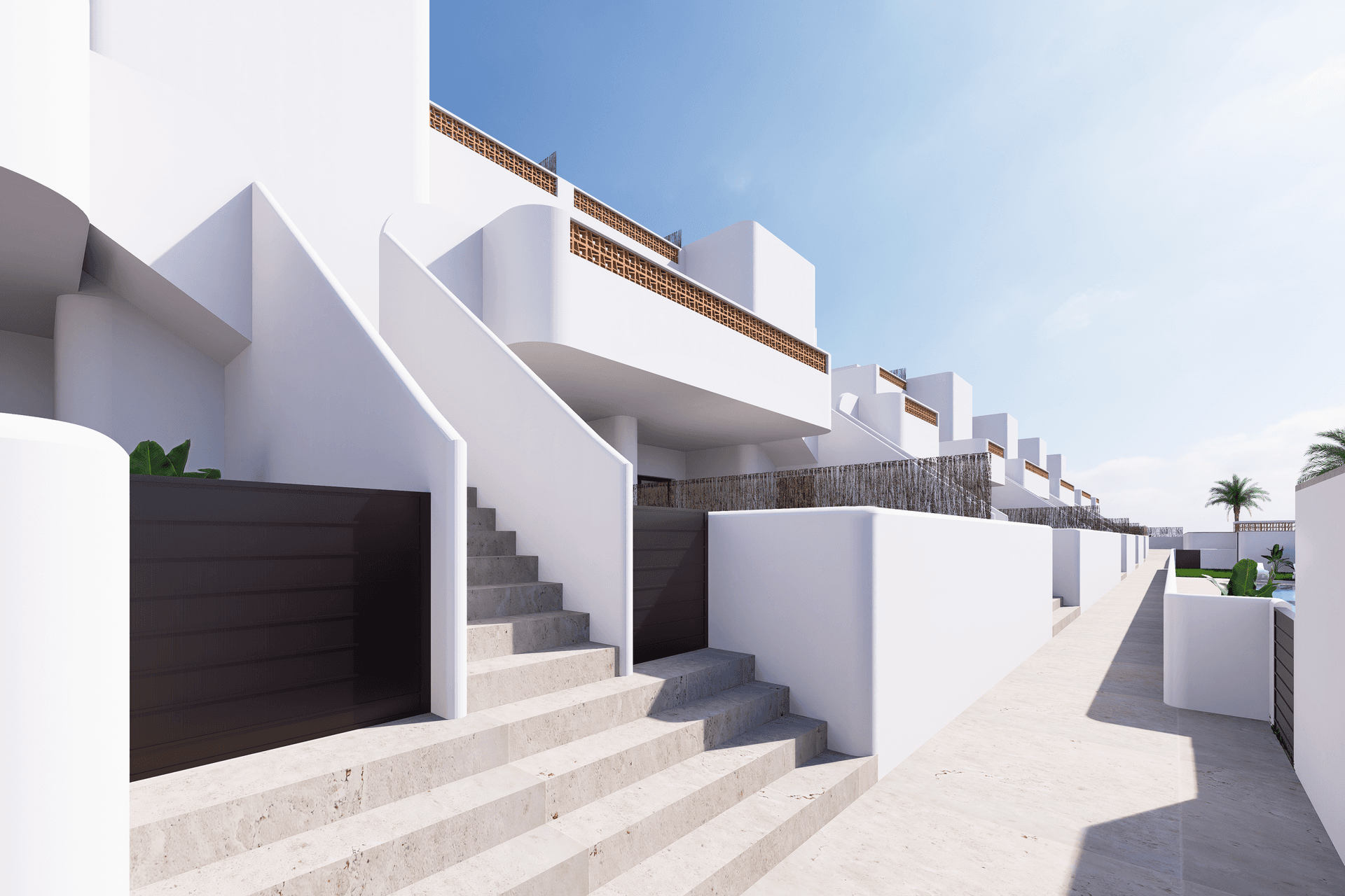 Moderne Reihenhäuser mit weißer Fassade und Außentreppen, die zu den oberen Ebenen führen.