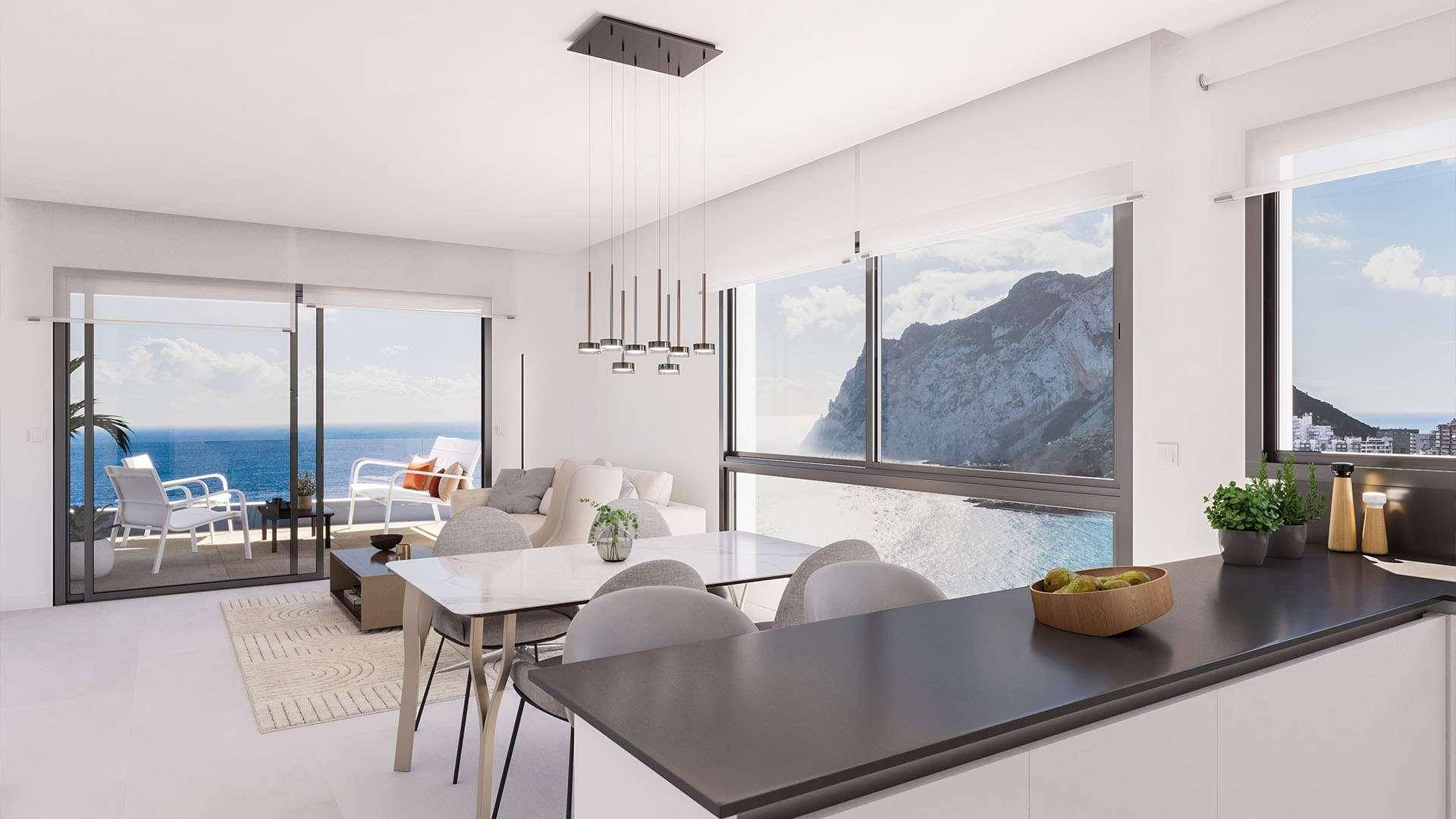 Offener Wohn- und Essbereich mit moderner Küche, großen Fenstern und Balkon mit atemberaubendem Meerblick.