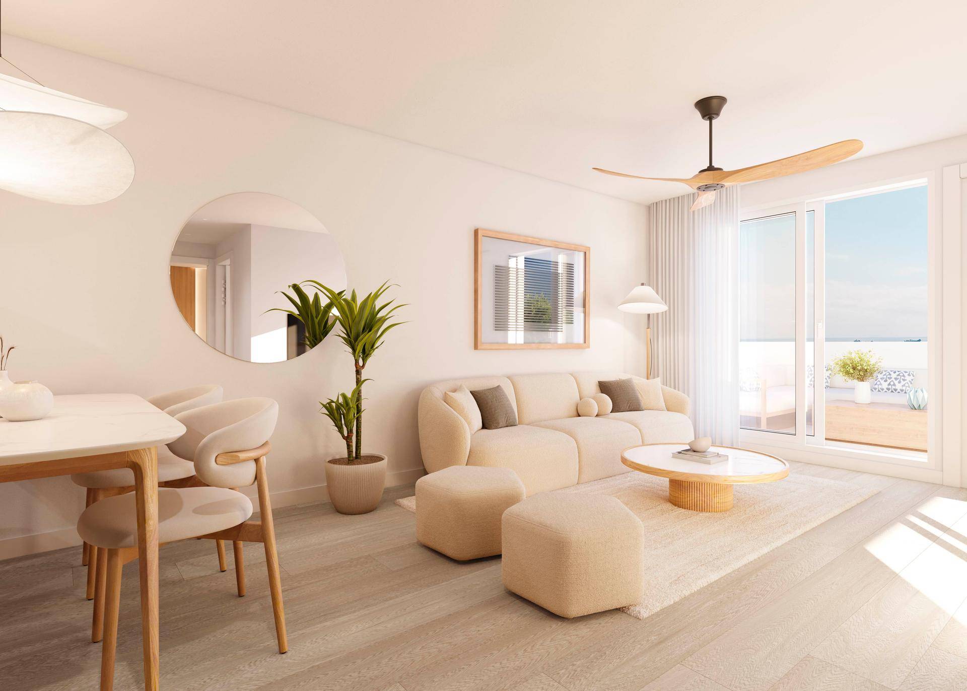 Helles, modern eingerichtetes Wohn-Esszimmer mit Holzboden, Deckenventilator und Zugang zur Terrasse.