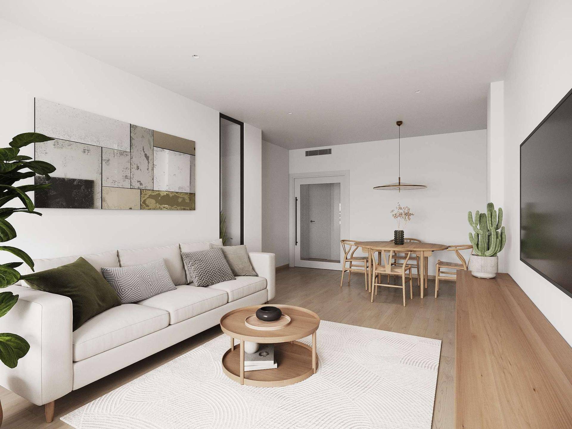 Gemütlicher Wohnbereich mit hellem Sofa, Holzboden und Essbereich im Hintergrund.