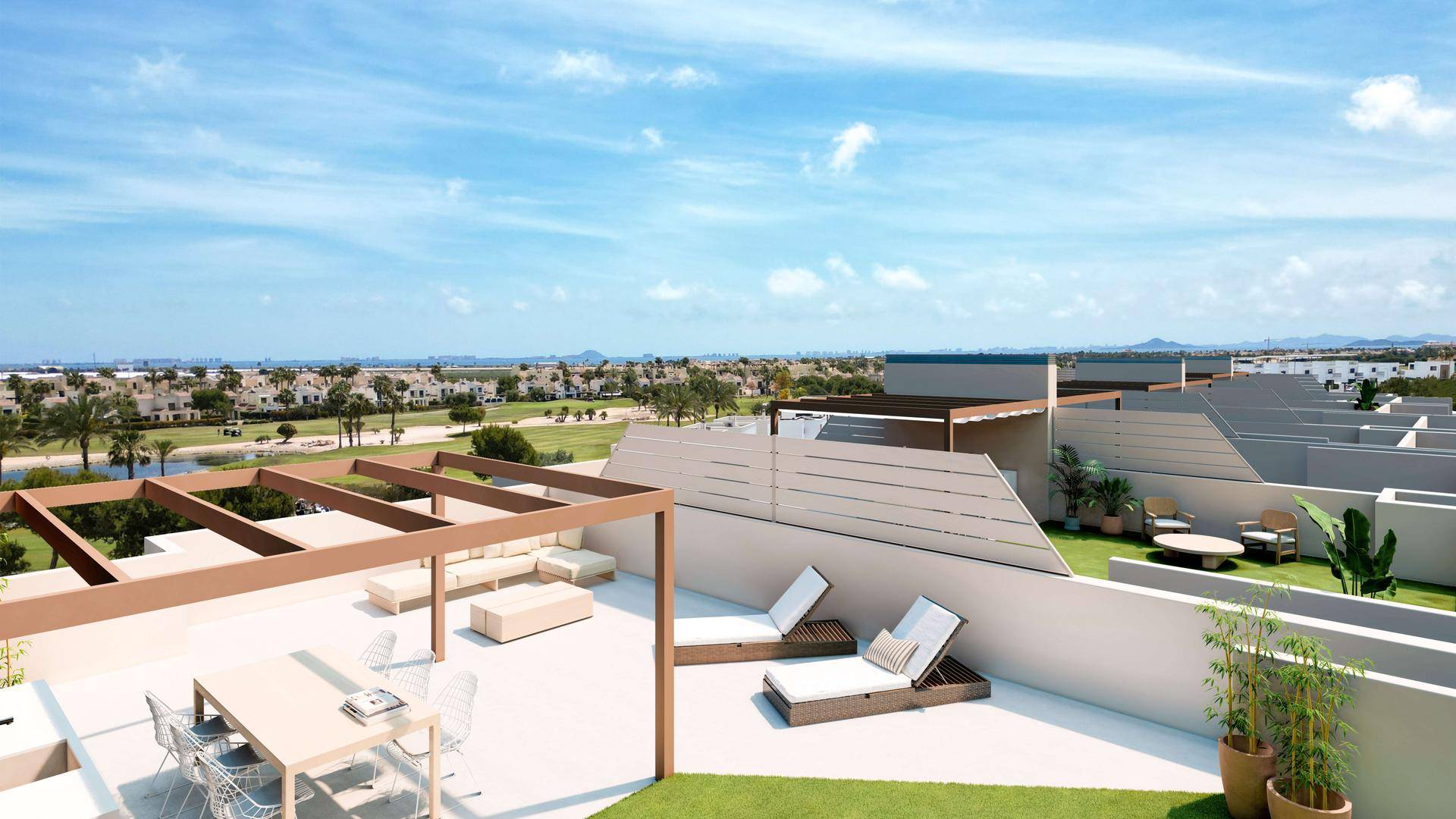 Großzügige Dachterrasse mit Pergola, Lounge-Möbeln und weitem Blick über die Umgebung.