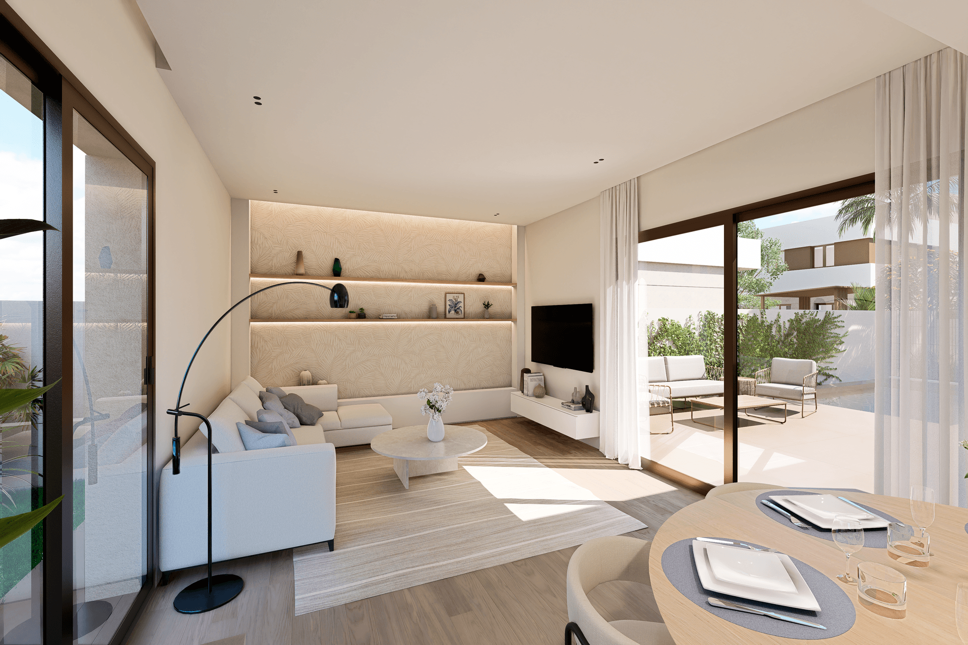 Modernes Wohnzimmer mit bequemer Couch, stilvoller Dekoration und Zugang zu einer Außenterrasse.