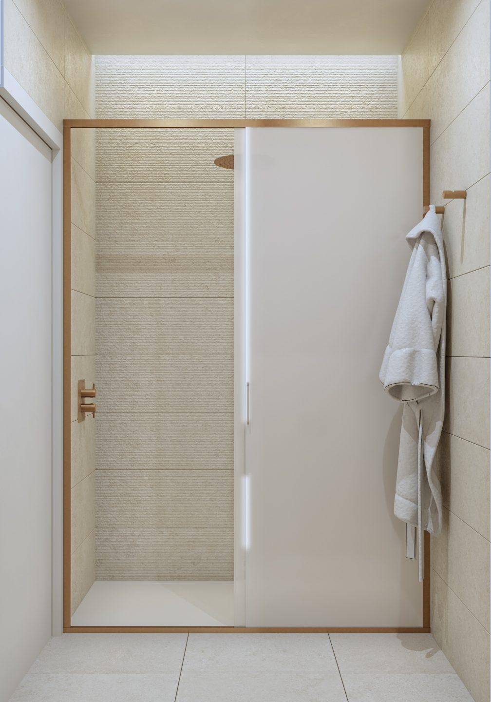 Helle Duschkabine mit Glastür und beigefarbenen Fliesen an den Wänden im modernen Badezimmer.