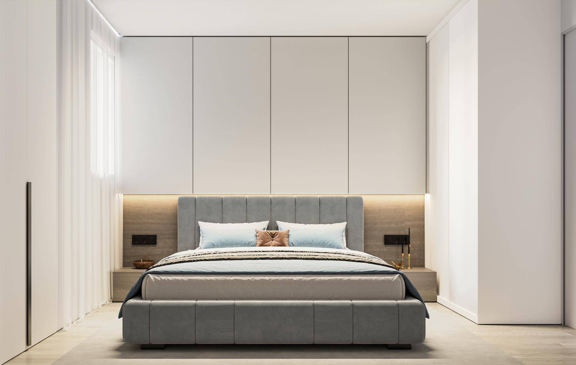 Elegantes Schlafzimmer mit großem Doppelbett, gepolstertem Kopfteil und praktischen Einbauschränken.