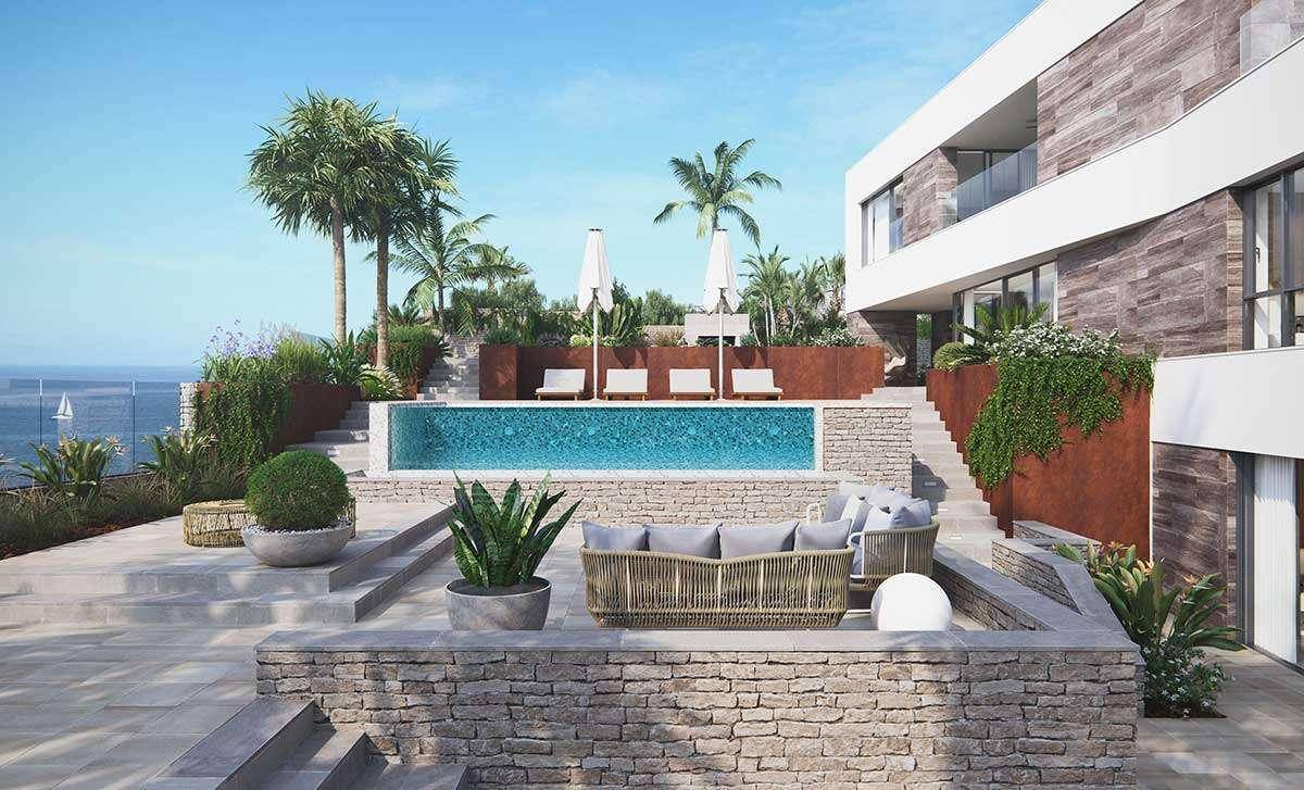 Luxuriöse Villa mit Meerblick, großem Poolbereich und stilvollen Outdoor-Möbeln auf mehreren Ebenen.