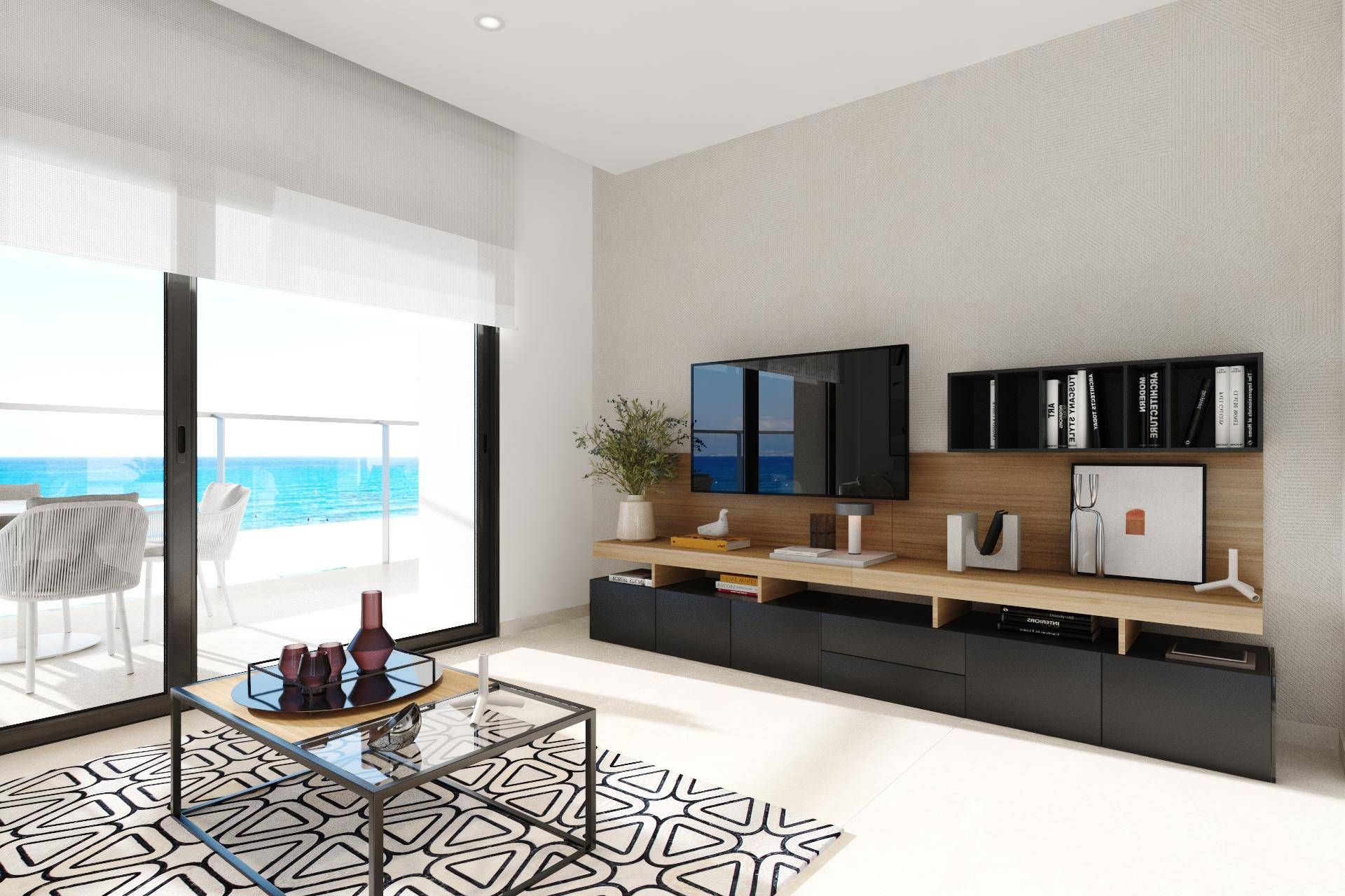 Modernes Wohnzimmer mit Meerblick, stilvollen Möbeln und Zugang zum Balkon.
