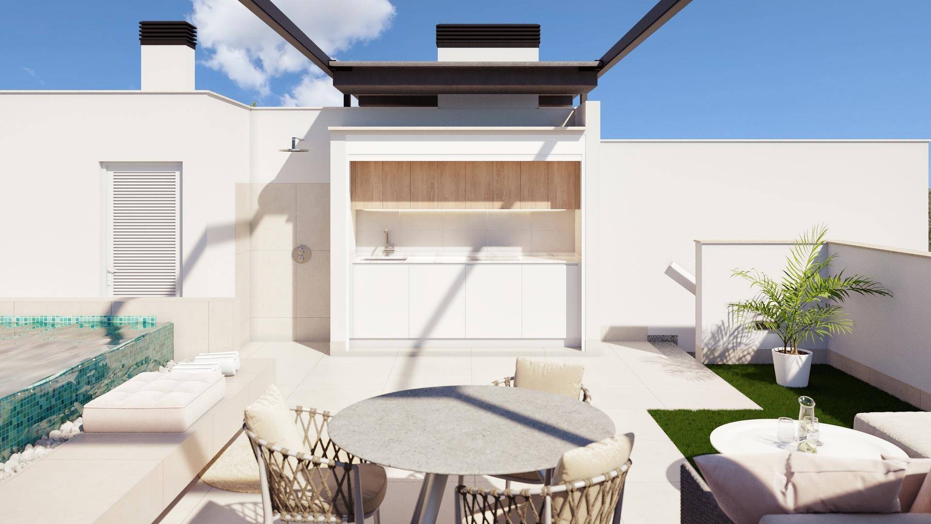 Dachterrasse mit kleinem Pool, Außenküche, Essbereich und Lounge-Möbeln unter blauem Himmel.