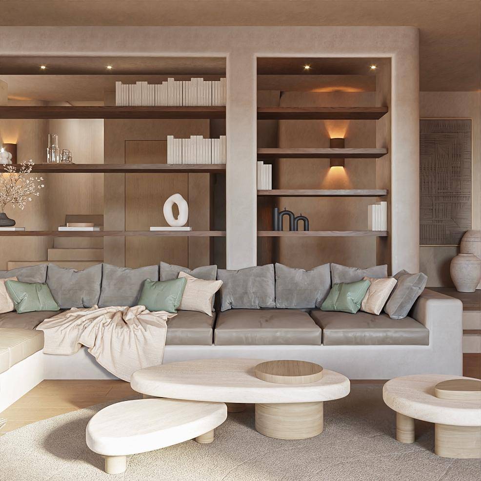 Geräumiges Wohnzimmer mit großer Eckcouch, Couchtischen und integrierten Bücherregalen.