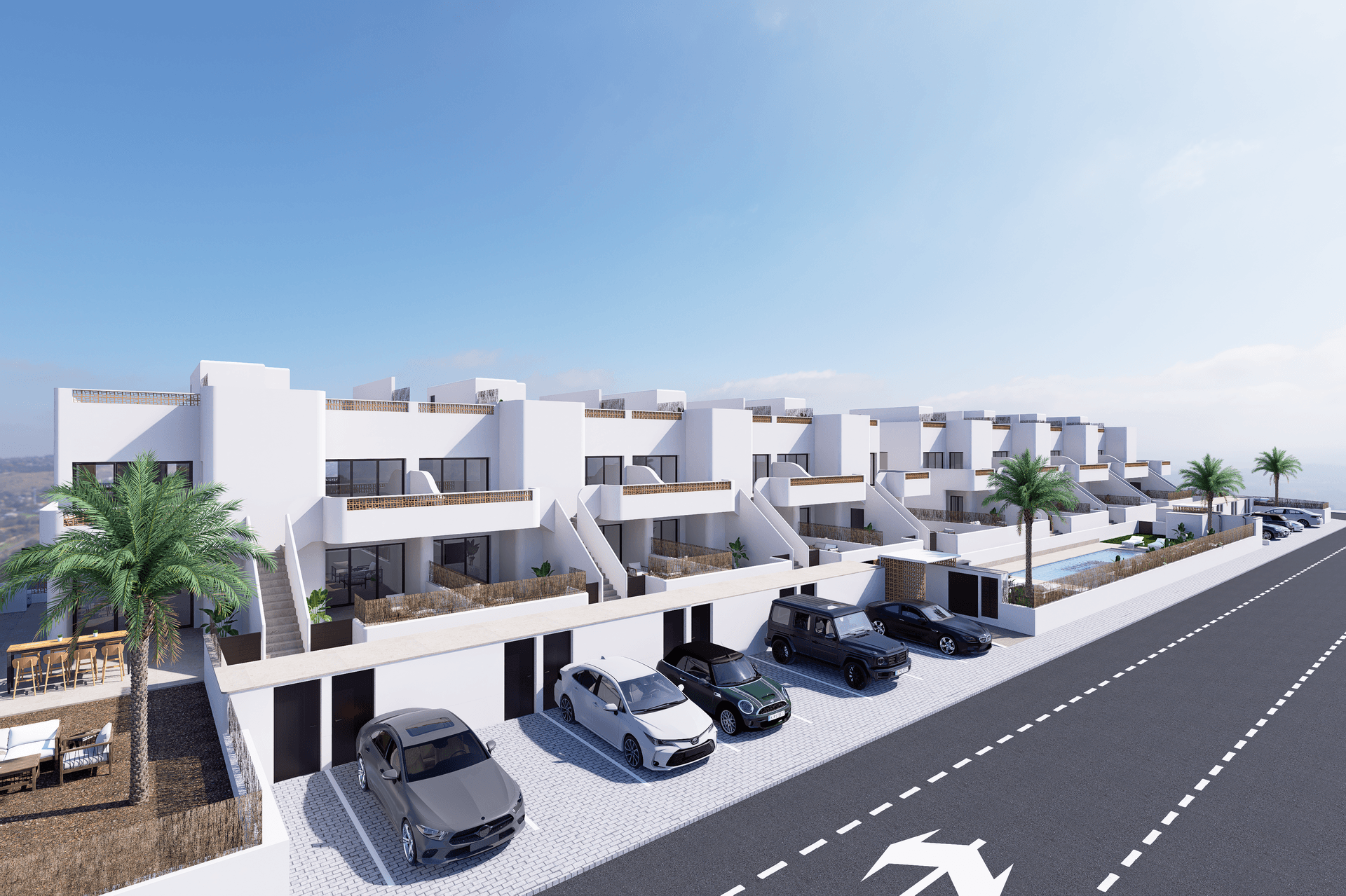 Gesamtansicht der modernen Reihenhaussiedlung mit Parkplätzen und mediterraner Bepflanzung.