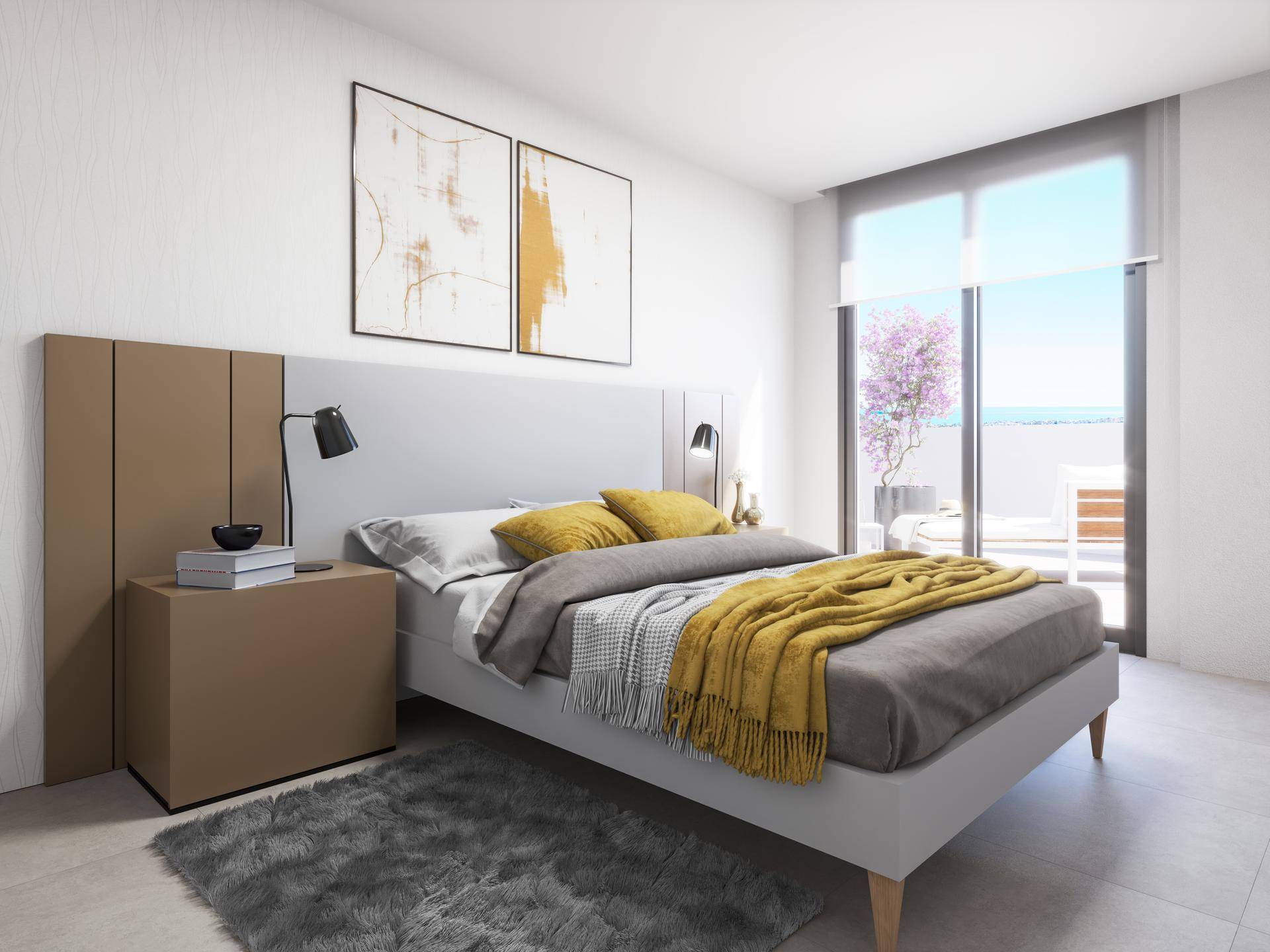 Schlafzimmer mit Doppelbett, modernen Nachttischen und Zugang zur Terrasse mit Meerblick.