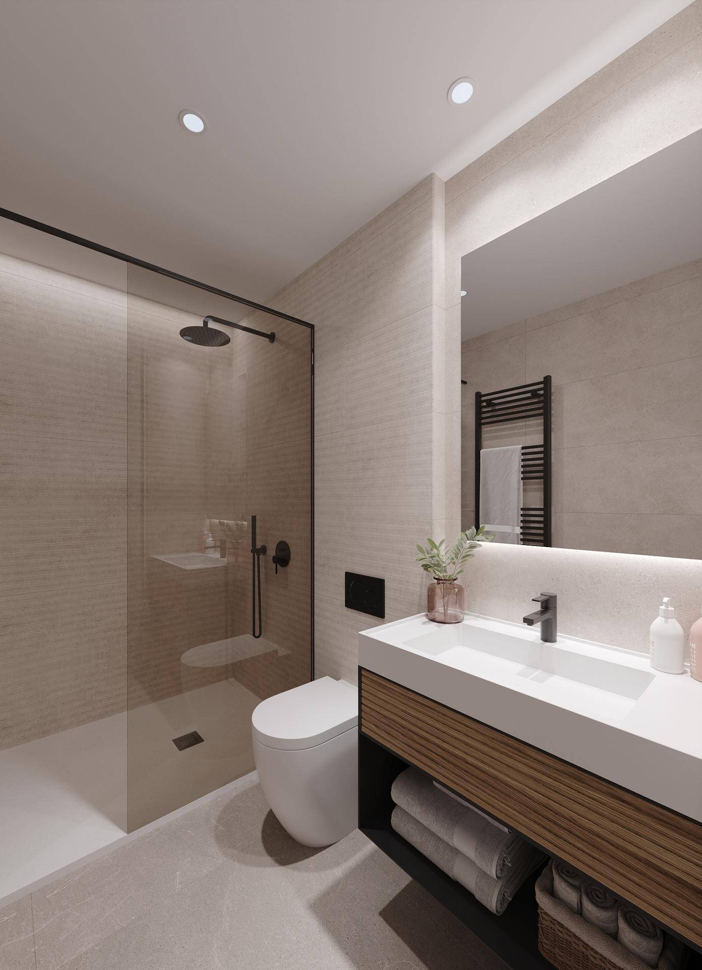 Helles Badezimmer mit modernem Waschtisch, begehbarer Dusche und beheiztem Handtuchhalter.
