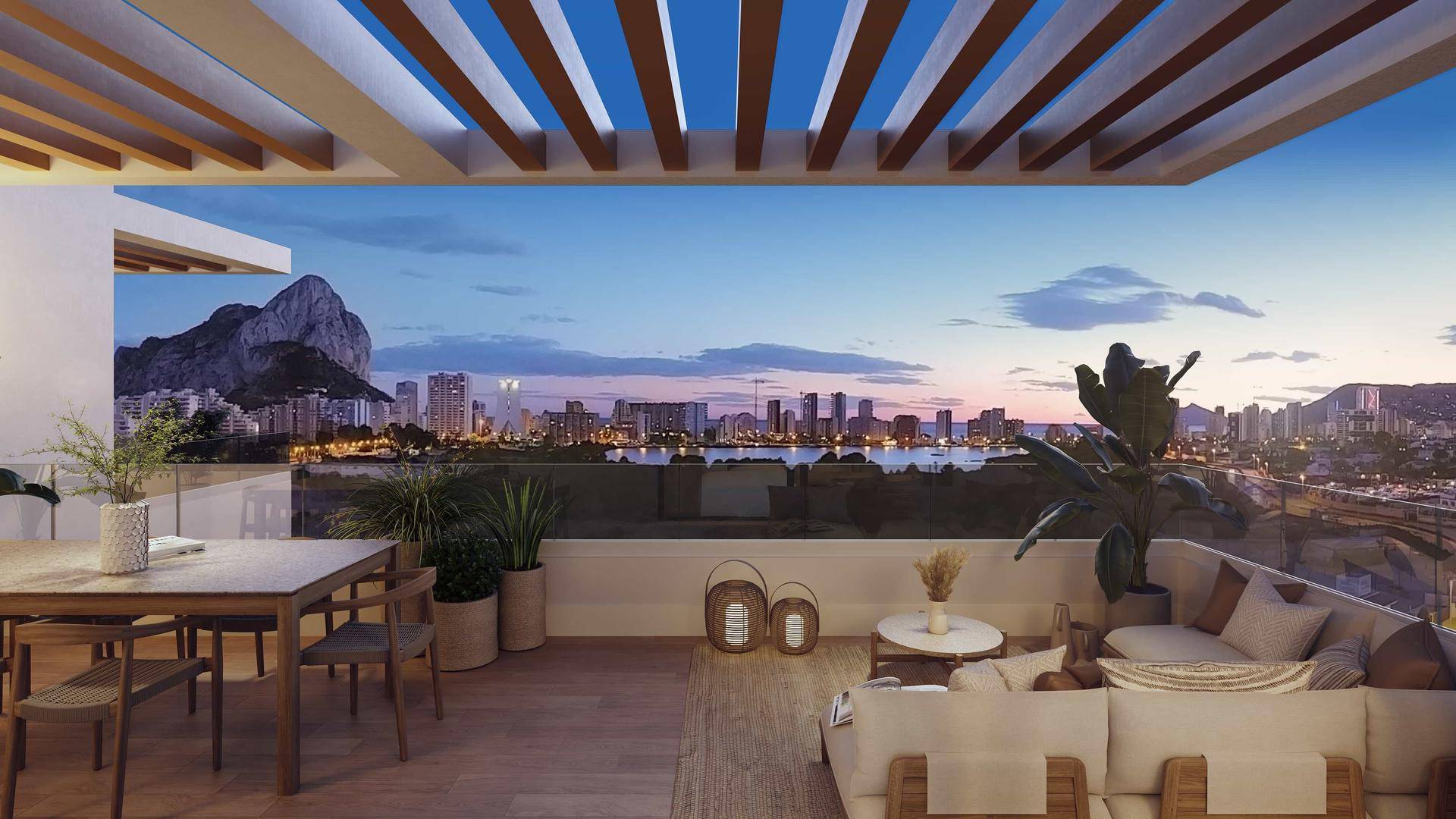 Große Dachterrasse mit atemberaubendem Stadt- und Bergblick bei Sonnenuntergang, ideal für Entspannung.