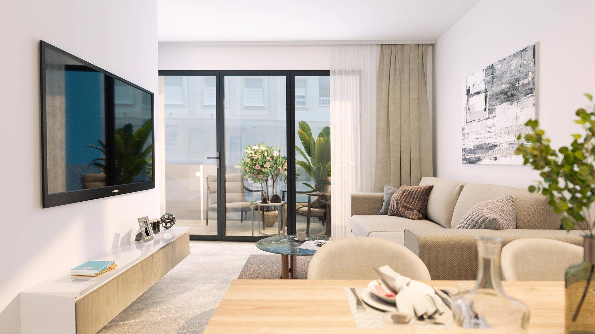 Helles Wohnzimmer mit modernem Sofa, Fernseher und Zugang zu einem Außenbereich.