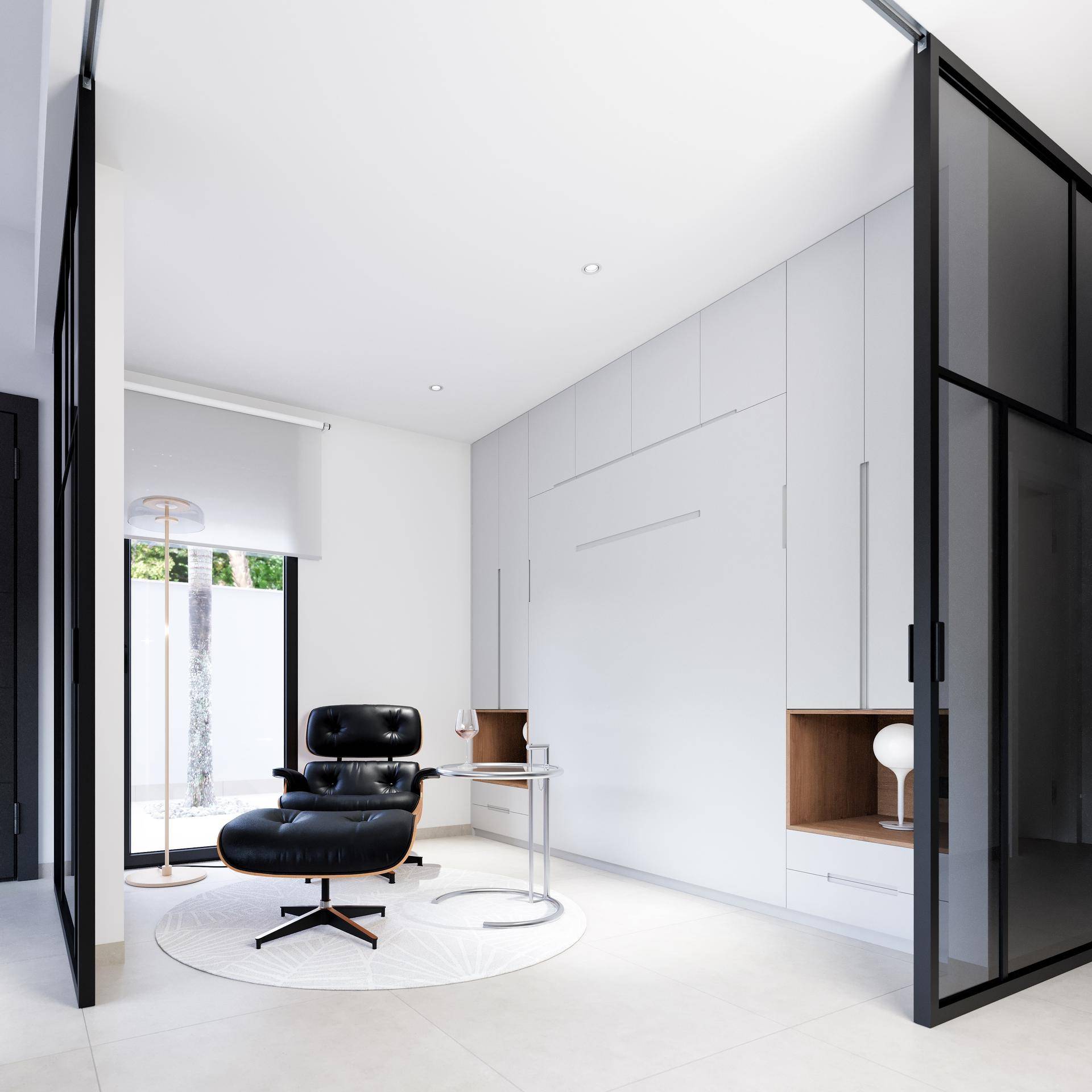 Modernes Arbeitszimmer mit minimalistischem Design, viel Tageslicht und stilvollem Sessel.