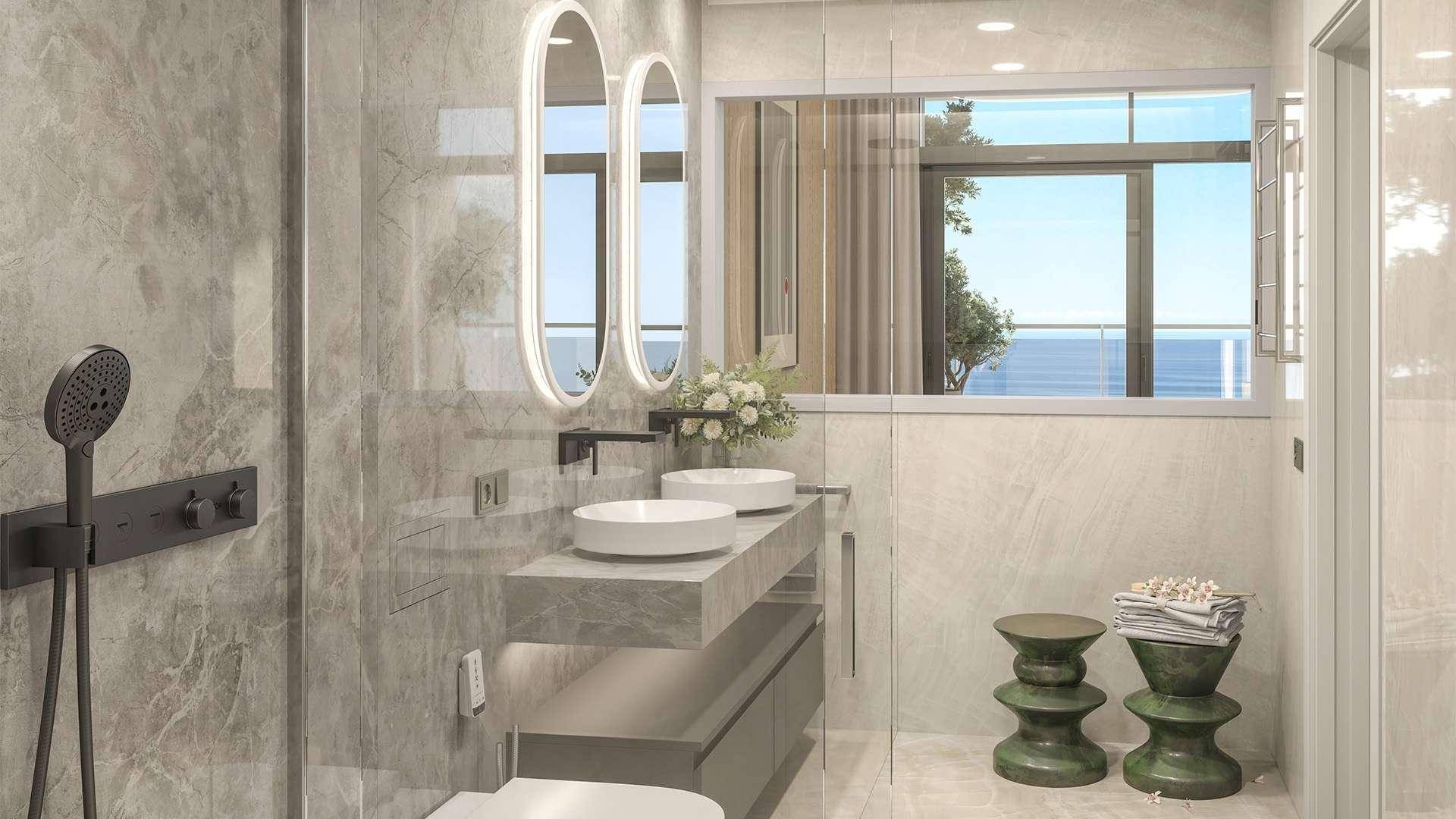 Elegantes modernes Badezimmer mit Doppelwaschbecken, begehbarer Dusche und Meerblick.