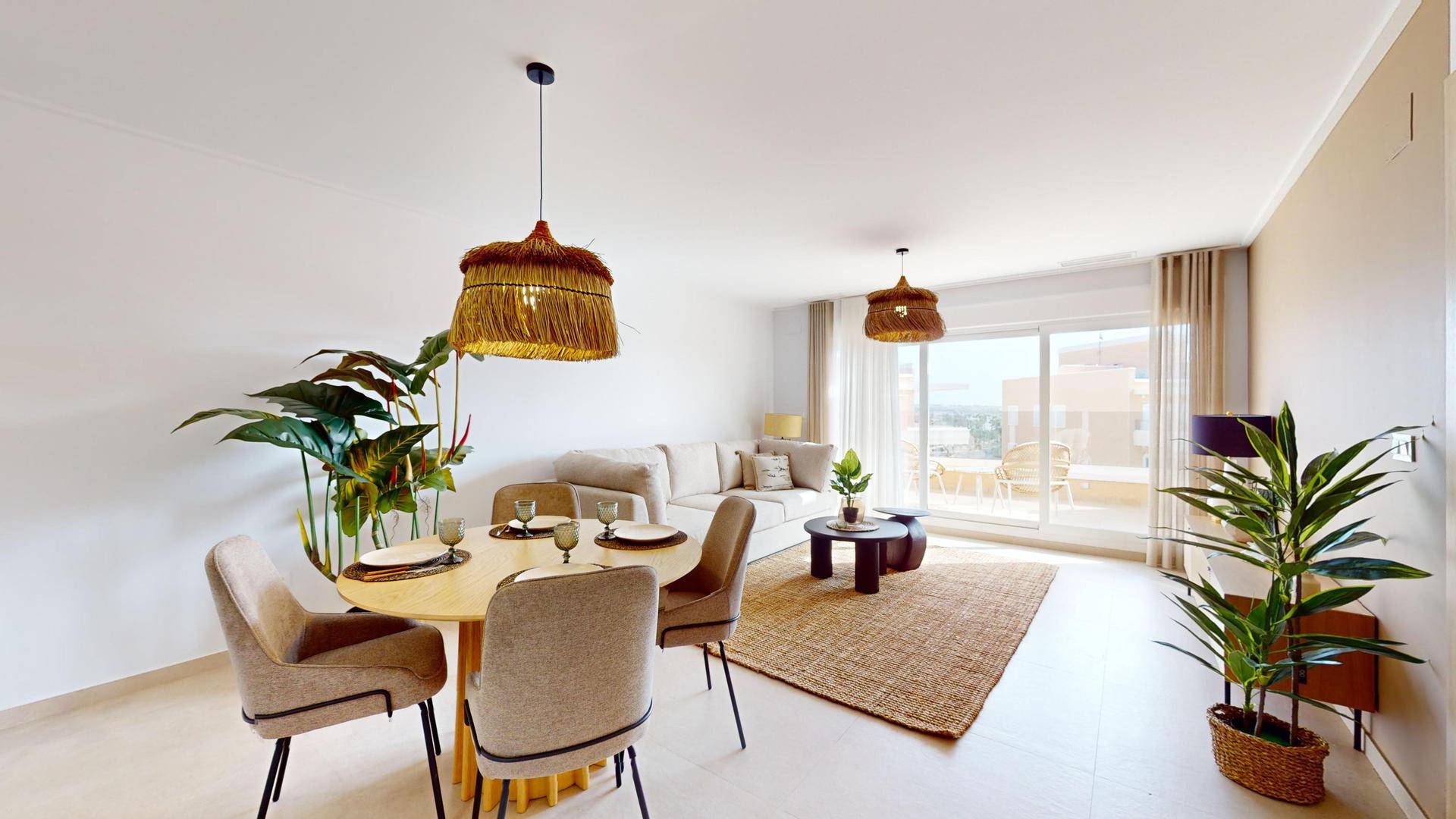 Gemütlicher Wohn- und Essbereich mit modernem Design und Zugang zu einer sonnigen Terrasse.