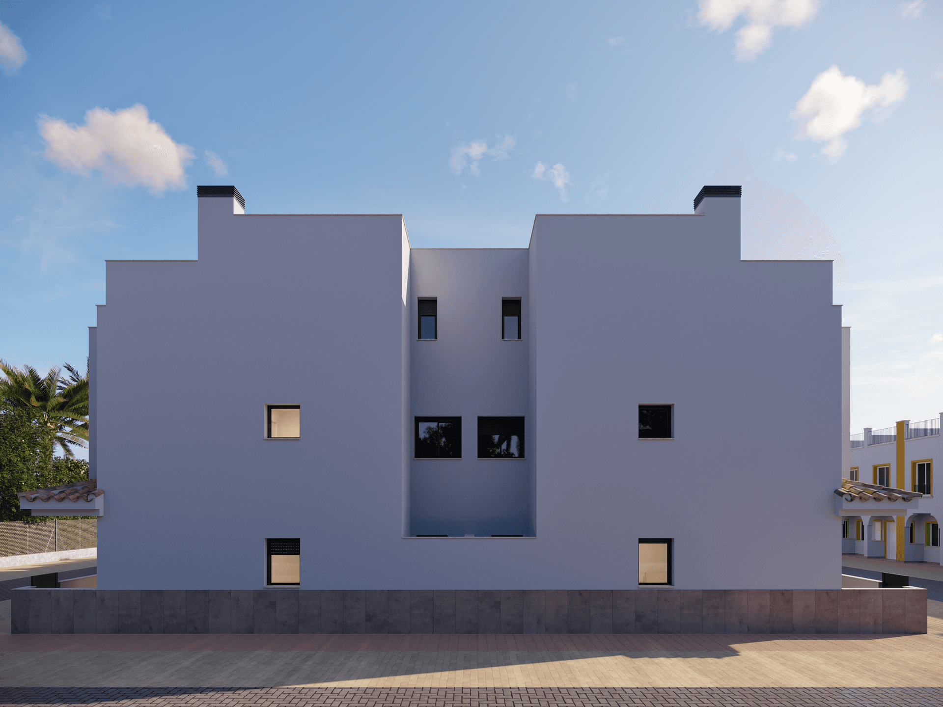 Rückansicht eines Reihenhauses mit minimalistischer Architektur und kleinen Fenstern.