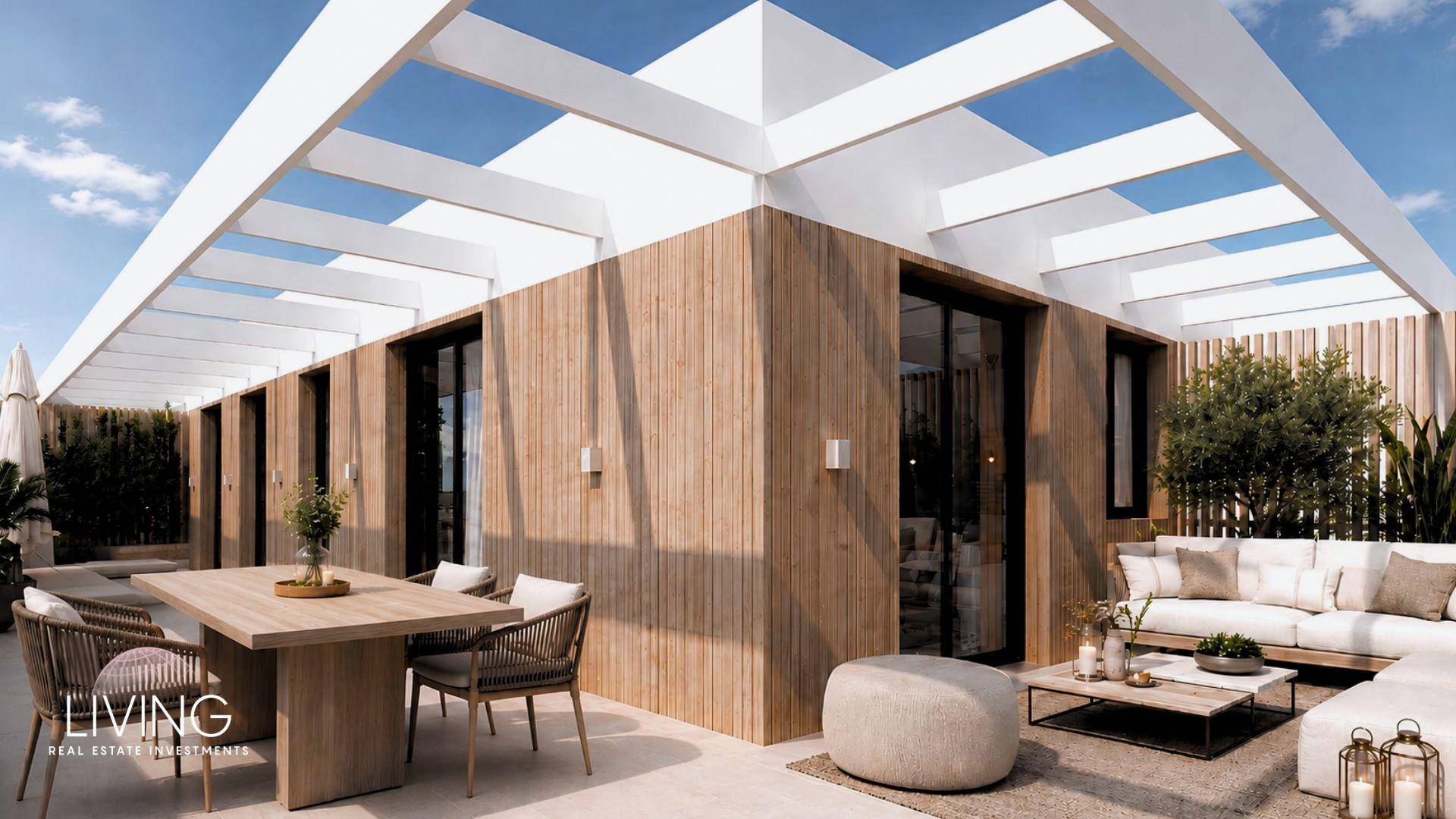 Sonniger Dachterrassenbereich mit Essplatz und Lounge-Ecke, umgeben von moderner Architektur.