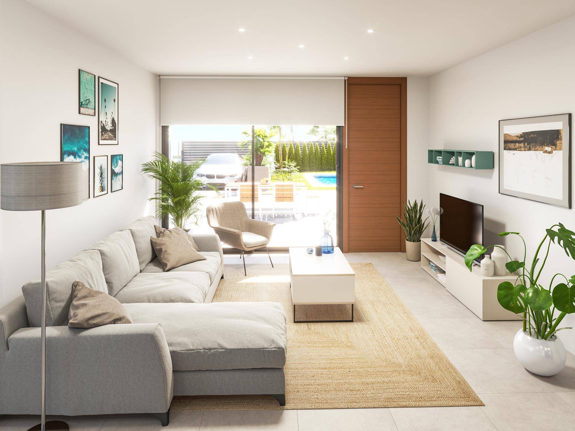 Helles Wohnzimmer mit bequemer Couch, modernen Möbeln und Zugang zum Garten.
