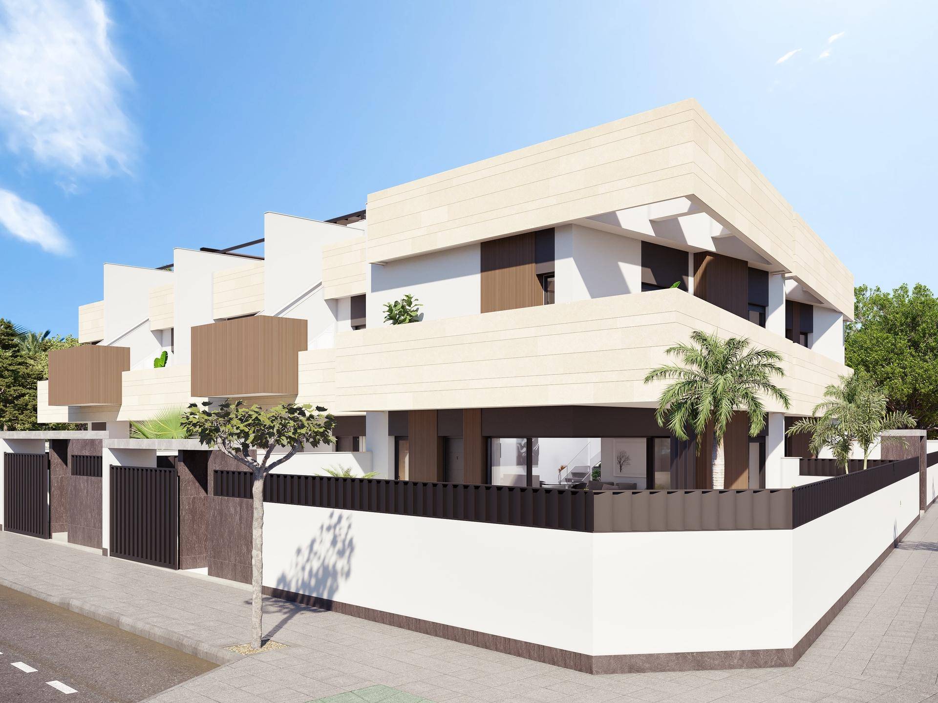 Moderne Reihenhauszeile mit klaren Linien und mediterraner Bepflanzung in sonniger Lage.