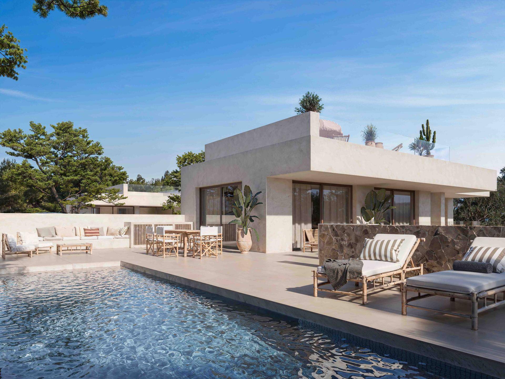 Entspannender Poolbereich mit Liegestühlen und einer Terrasse, umgeben von mediterraner Vegetation.