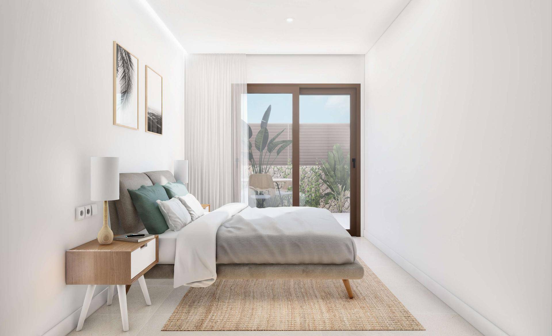Schlafzimmer mit direktem Zugang zum Garten und moderner Einrichtung.