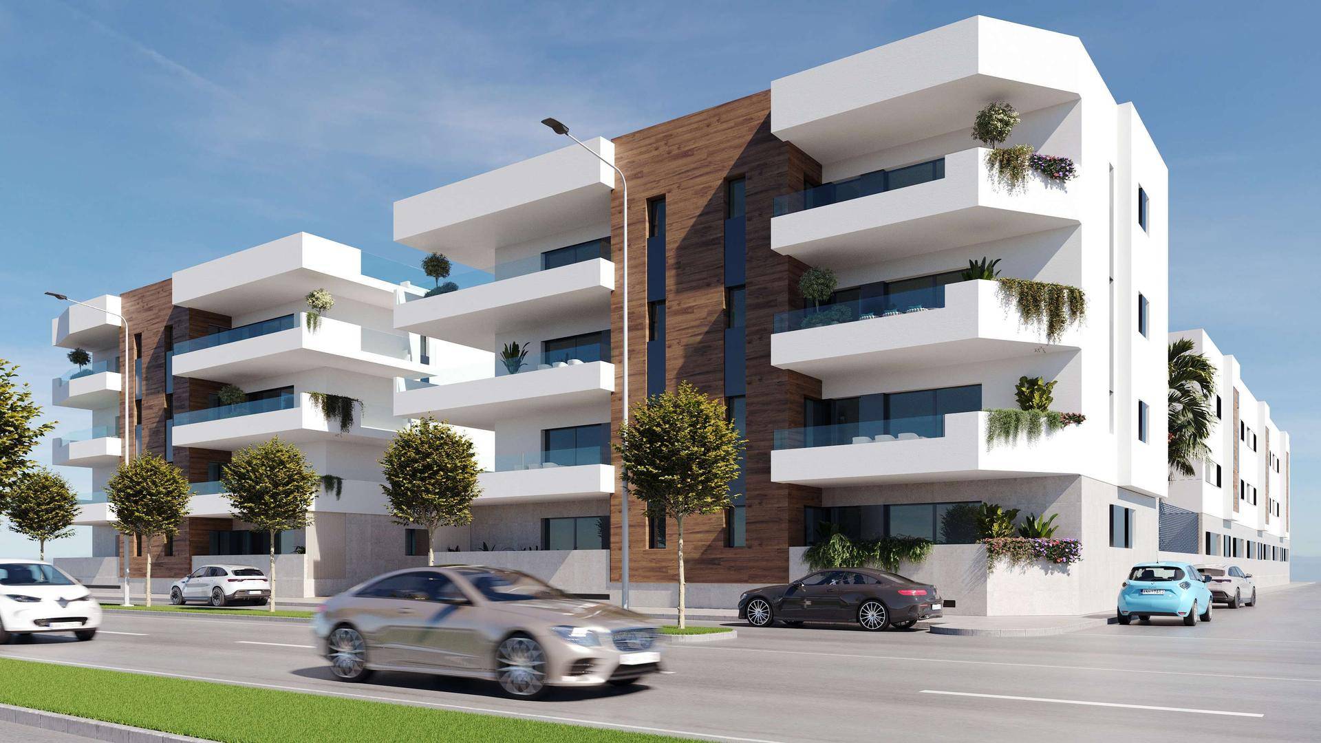 Moderne Wohngebäude mit großen Balkonen und Holzverkleidung an der Fassade entlang einer Straße.