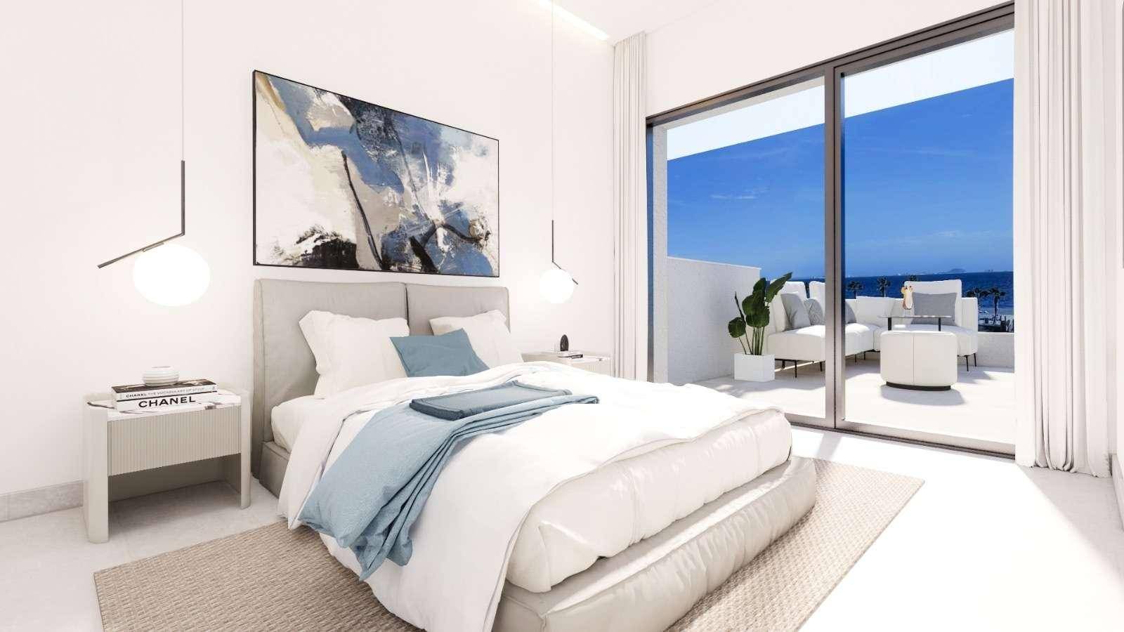 Elegantes Schlafzimmer mit Zugang zu einer Terrasse und herrlichem Meerblick, modern eingerichtet.