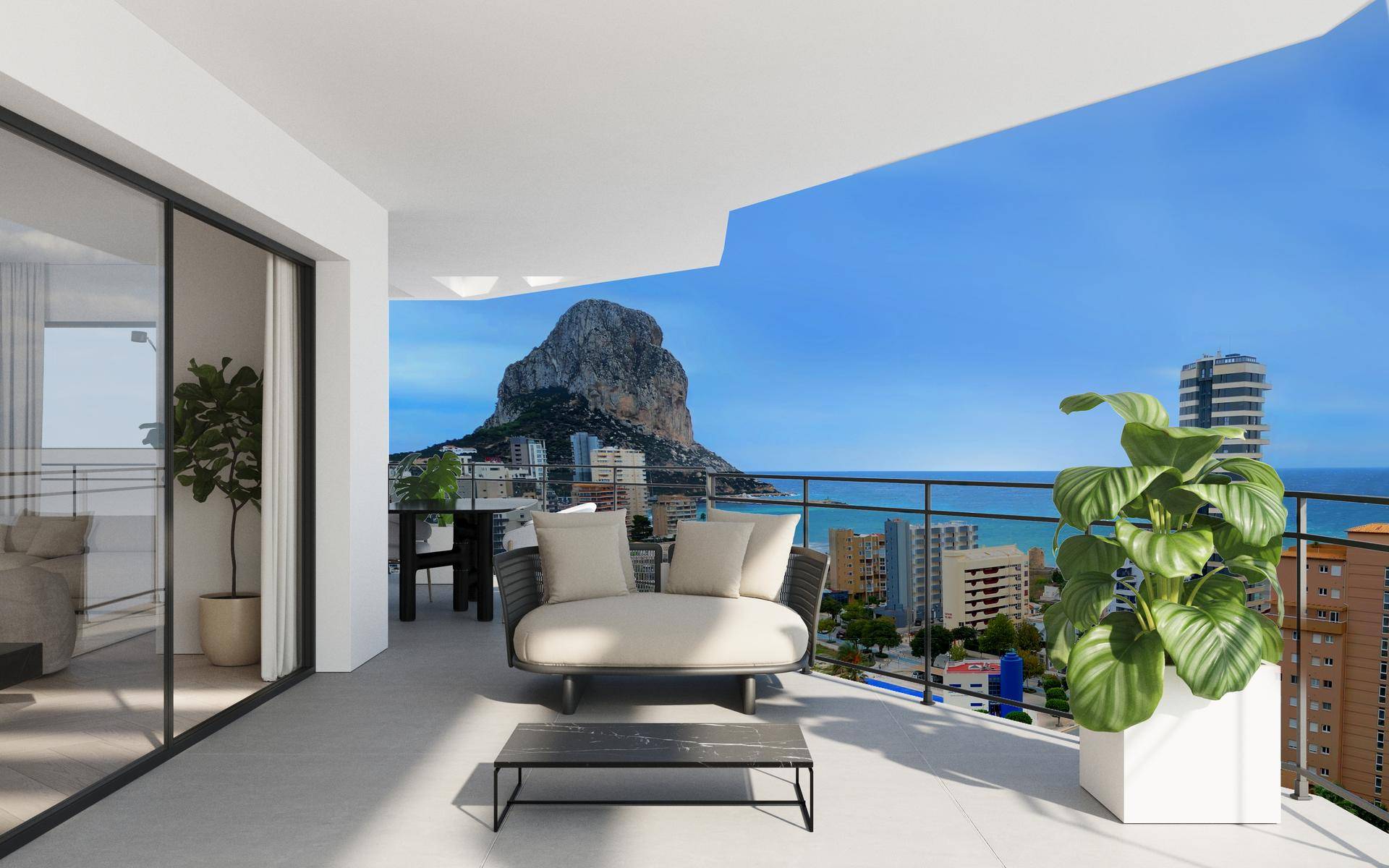 Geräumiger Balkon mit modernen Möbeln und atemberaubendem Blick auf das Meer und einen Felsen.
