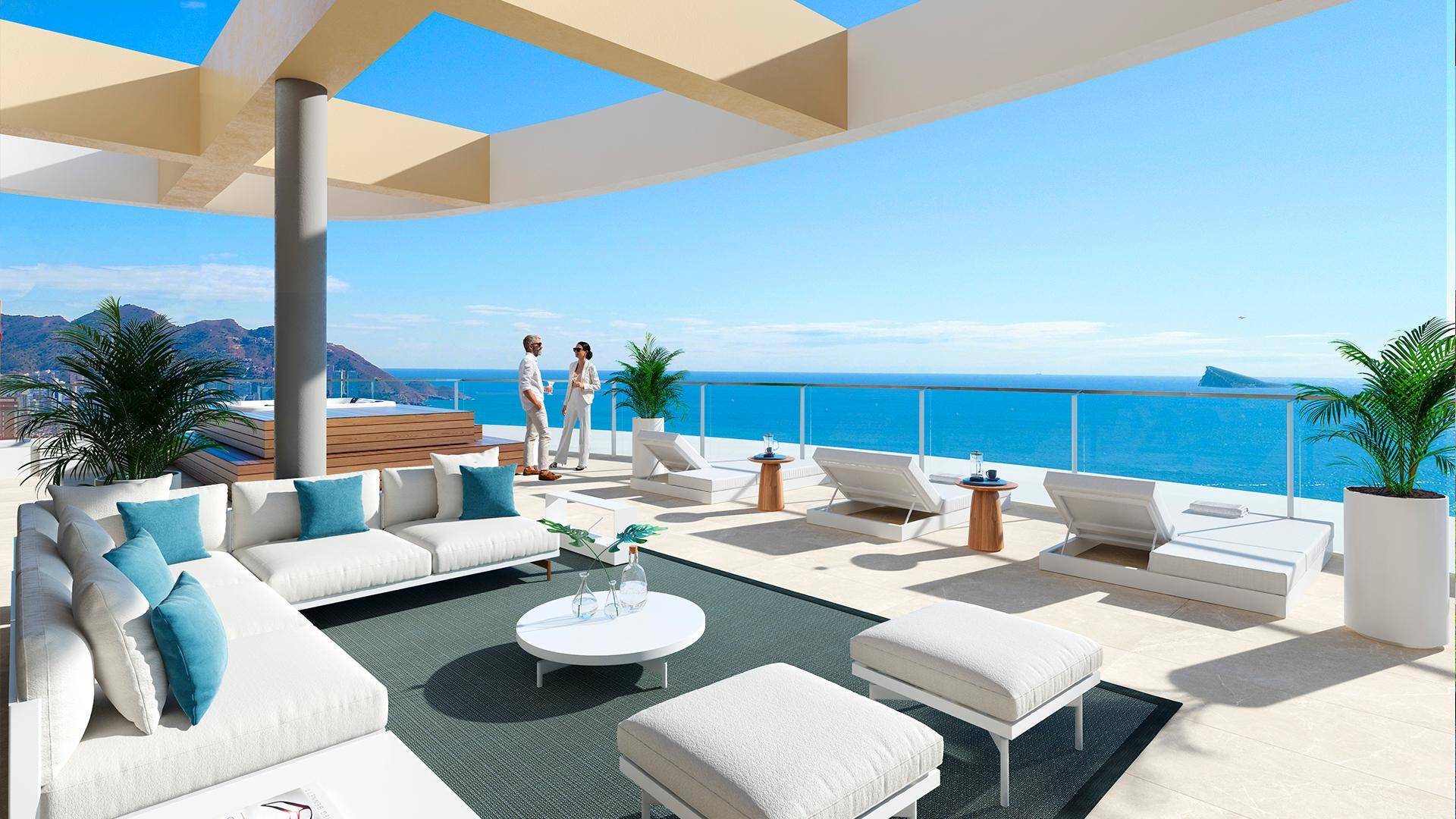 Großzügige Dachterrasse mit Lounge-Bereich, Sonnenliegen und Panoramablick auf das Meer.