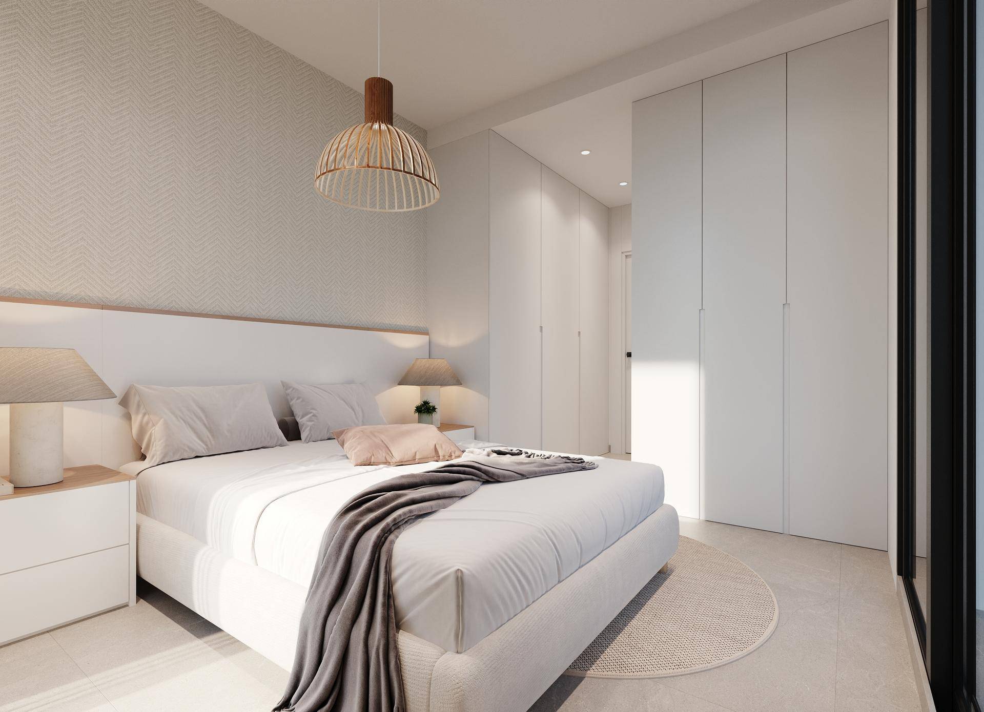 Helles Schlafzimmer mit großem Doppelbett, integrierten Kleiderschränken und modernem Design.