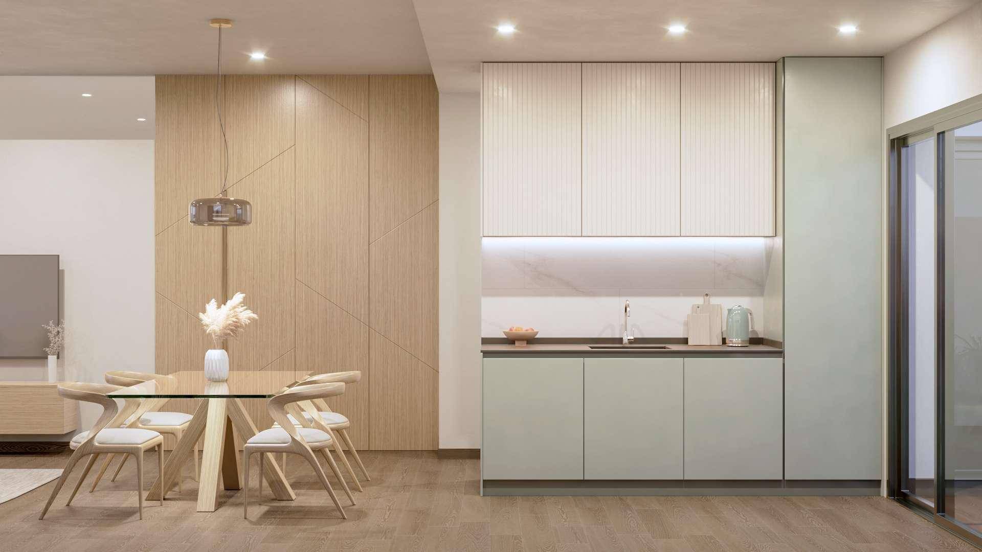 Helle Küche mit integriertem Essbereich und modernen Holzpaneelen an der Wand.