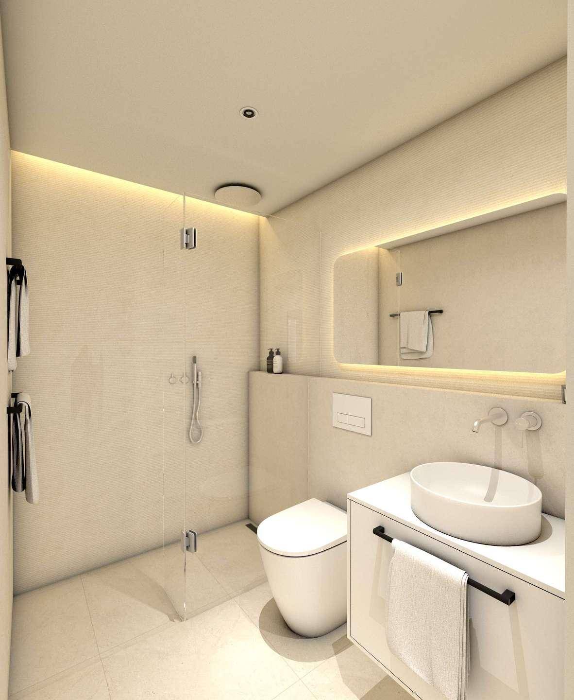 Elegantes Badezimmer mit integrierter Beleuchtung, modernem Waschbecken und rahmenloser Glasdusche.